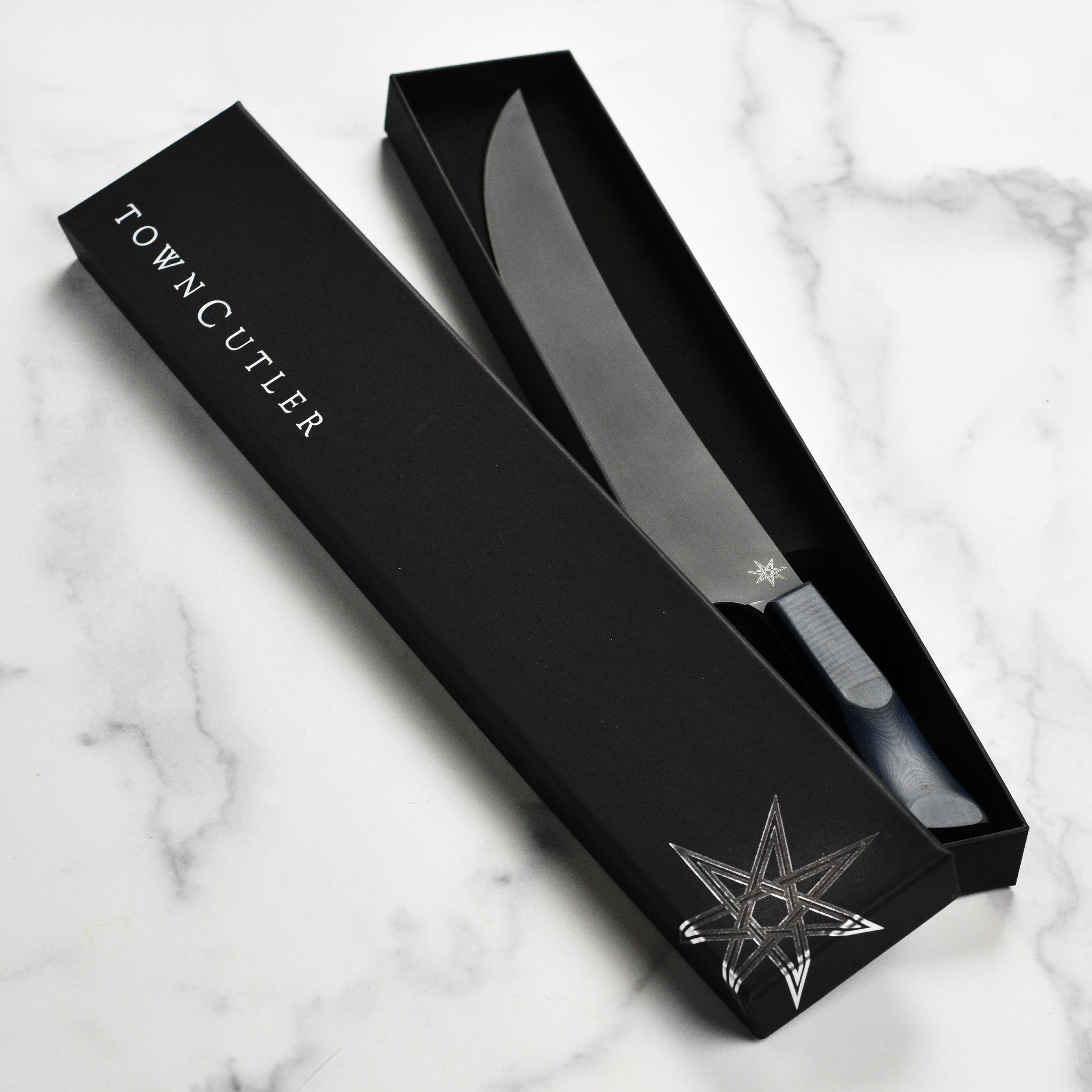 Handcrafted stainless steel chef knife with cerakote finish, perfect for home cooks and professional chefs