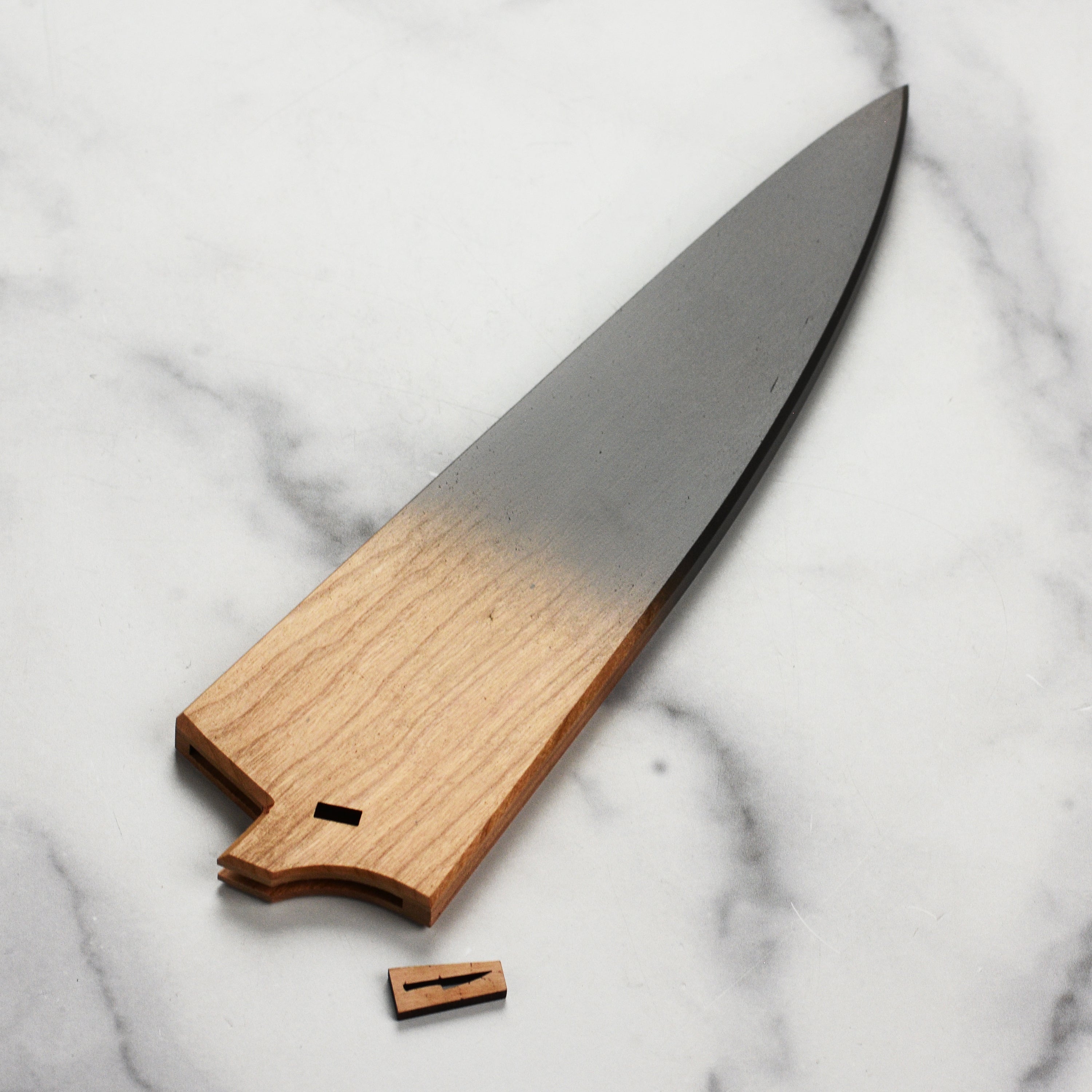 Close-up of charcoal gray accent on Town Cutler eXo Blue knife saya.