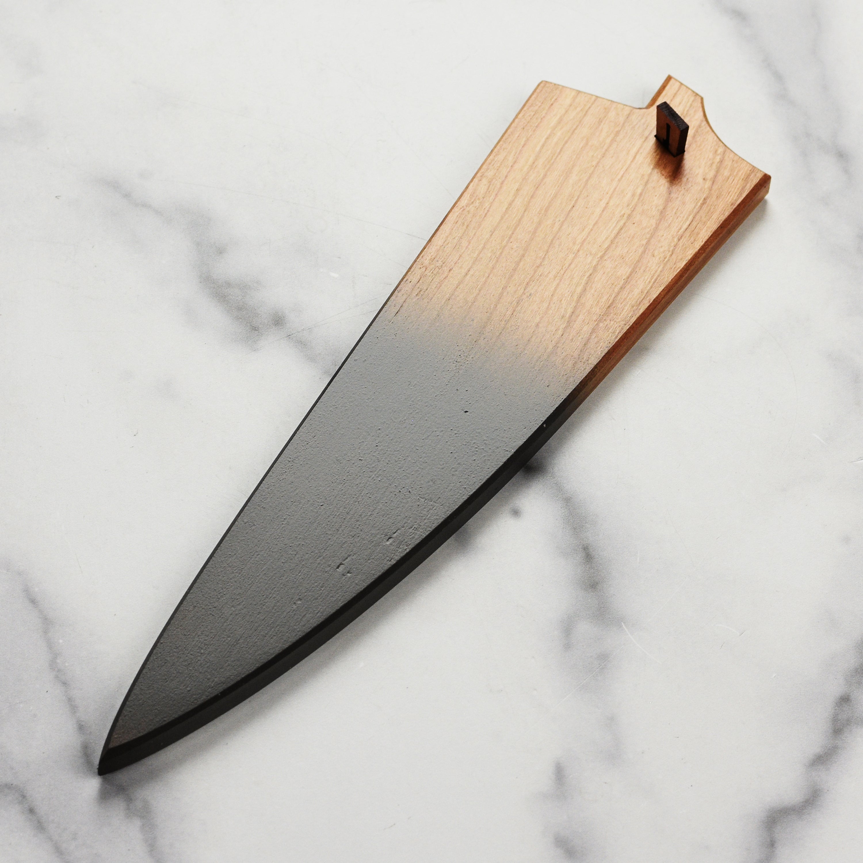 Side view of Town Cutler eXo Blue knife saya showcasing cherry wood design.