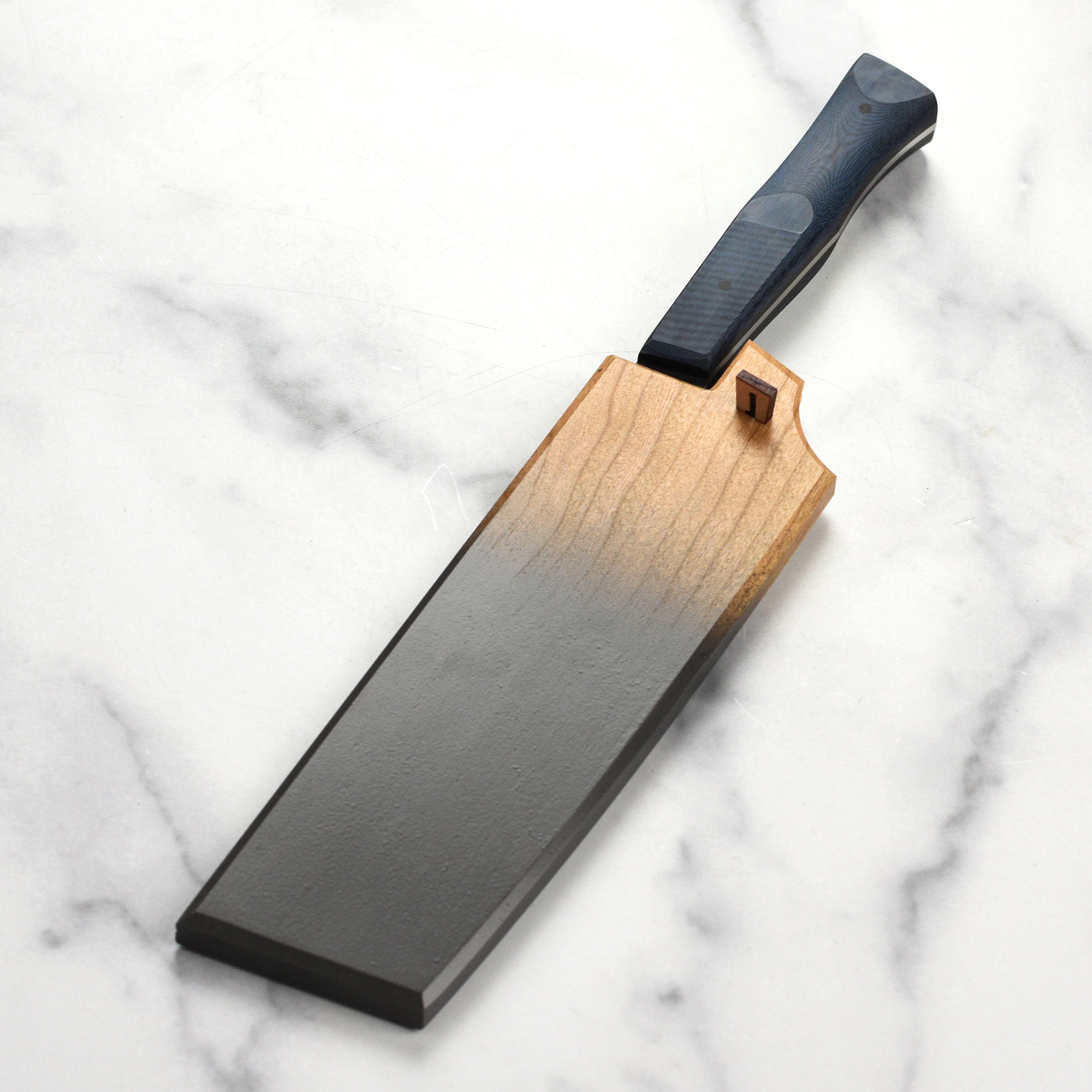 Side profile of cherry saya with pin detail for secure knife storage