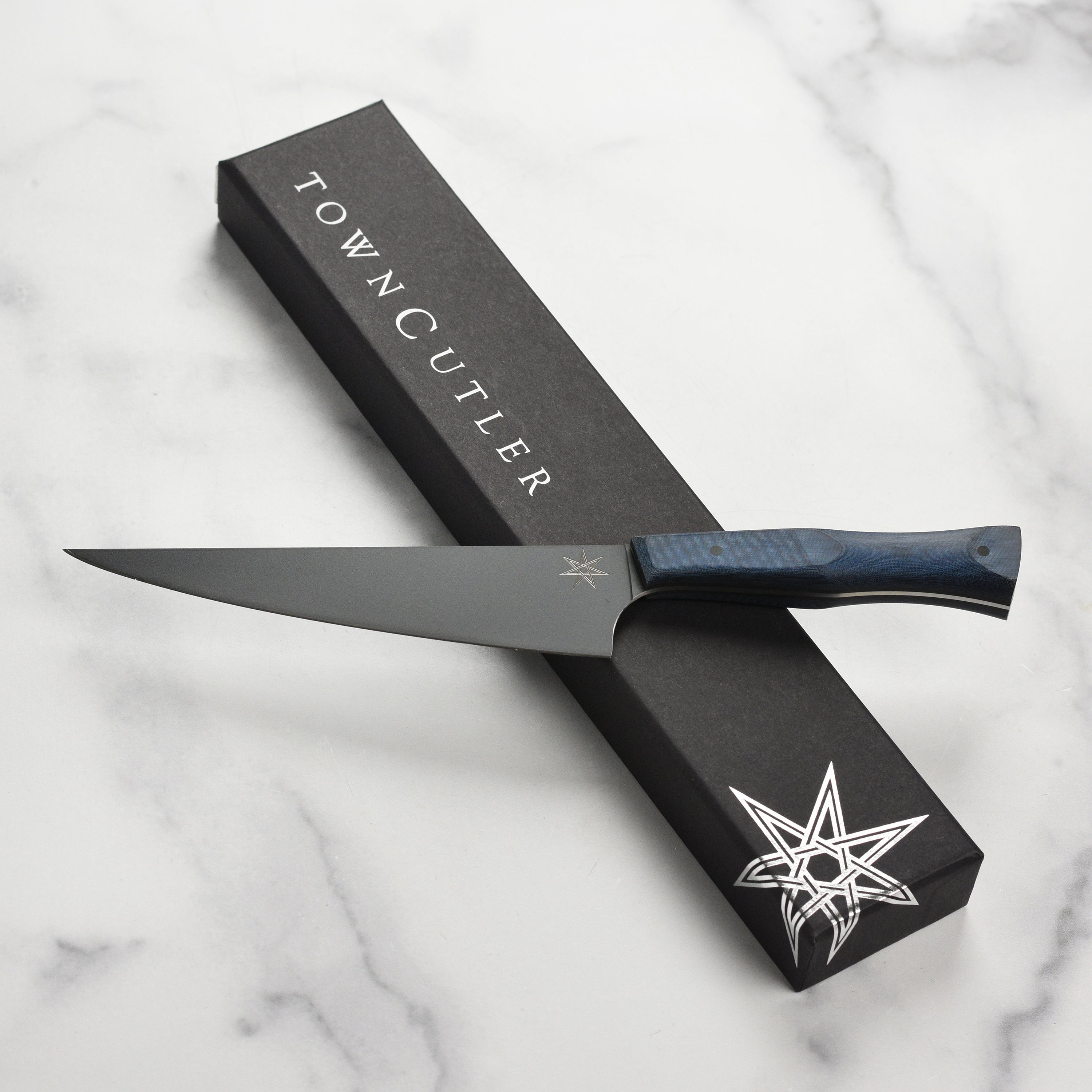 Front view of the Town Cutler eXo Blue 6-inch utility knife with stainless steel blade and micarta handle