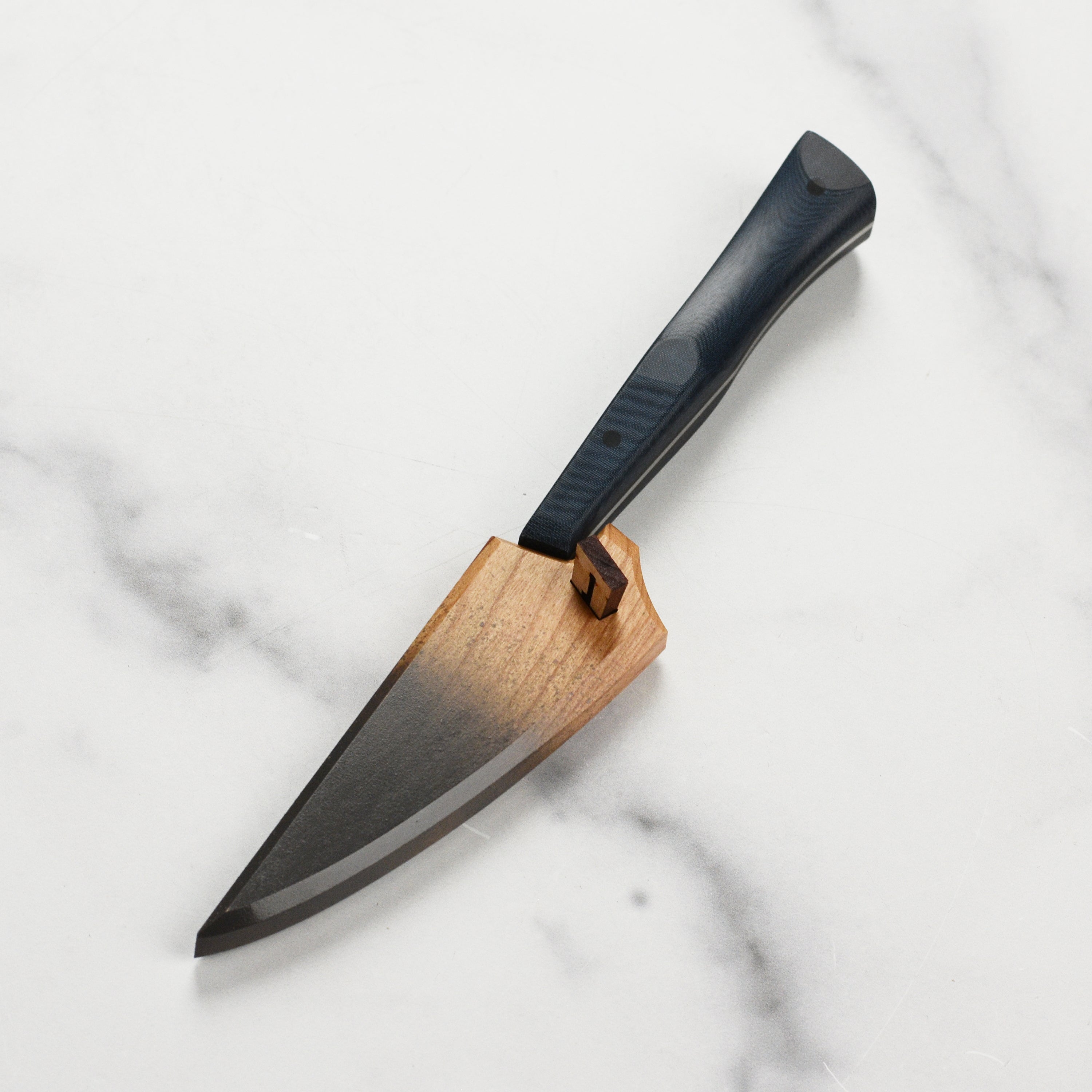 Handmade kitchen knife storage solution featuring charcoal gray accents for protection.