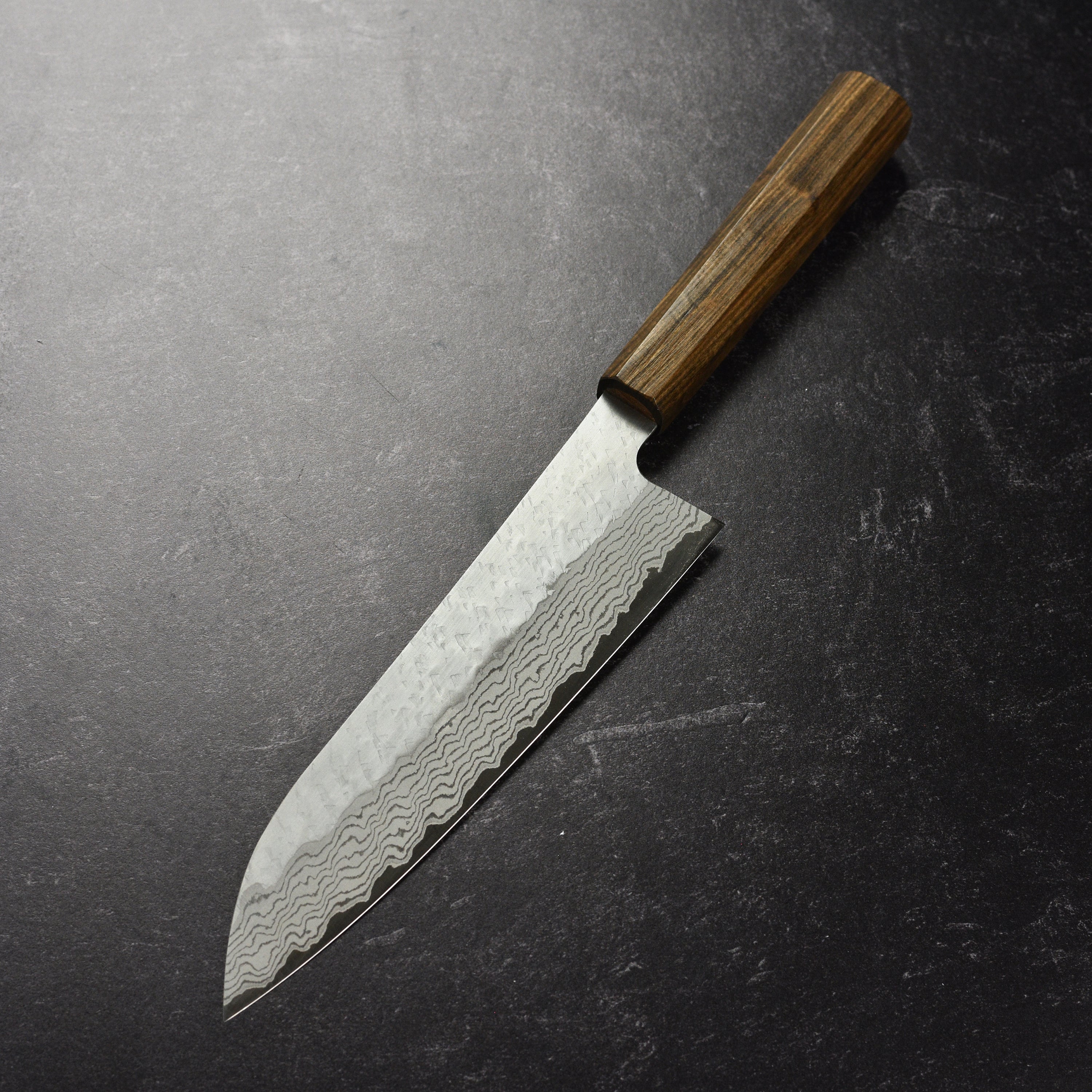 Tsuchime Damascus Gyuto Knife in action while chopping vegetables