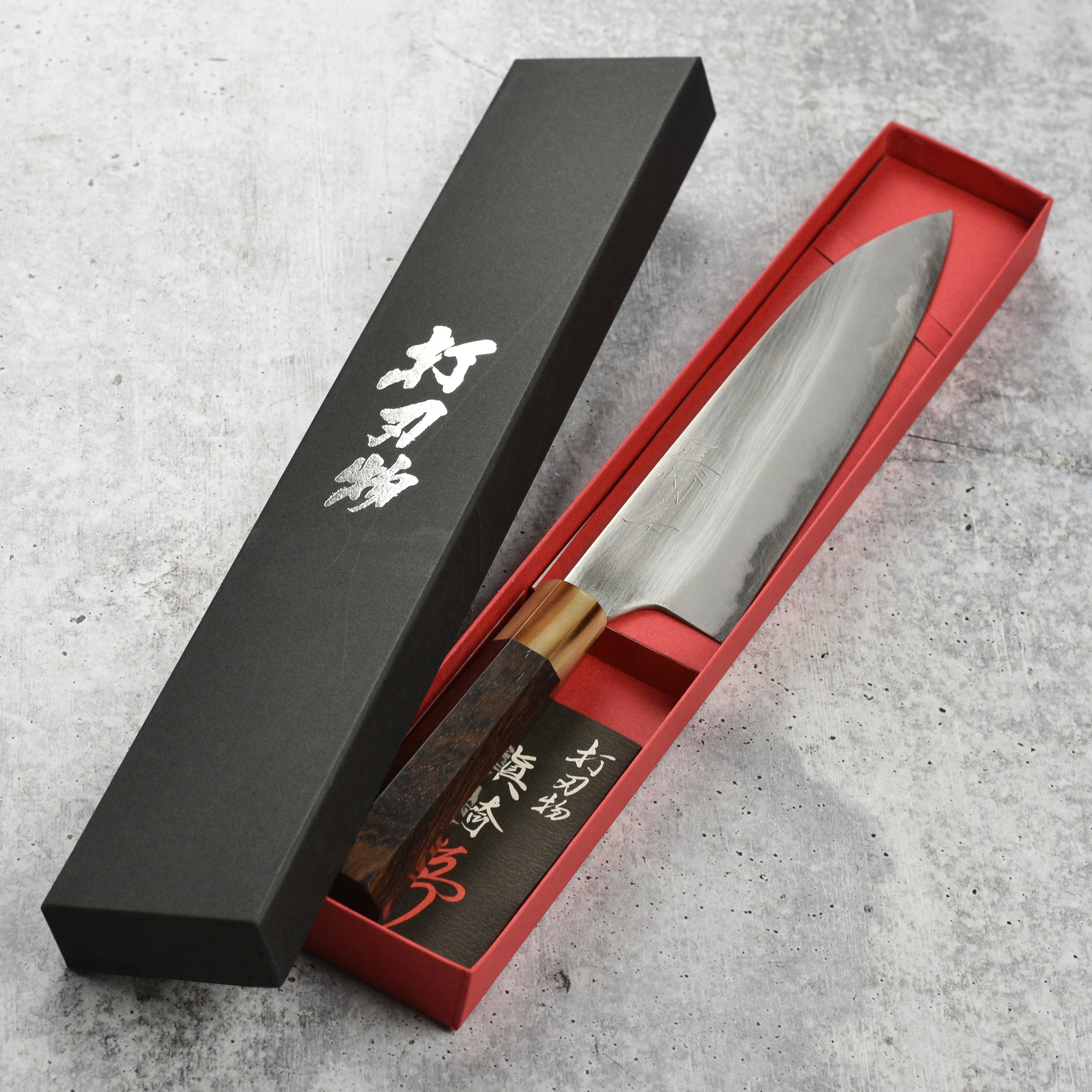 Mazaki Shirogami Gyuto 8.25" chef knife with wooden handle, angled view