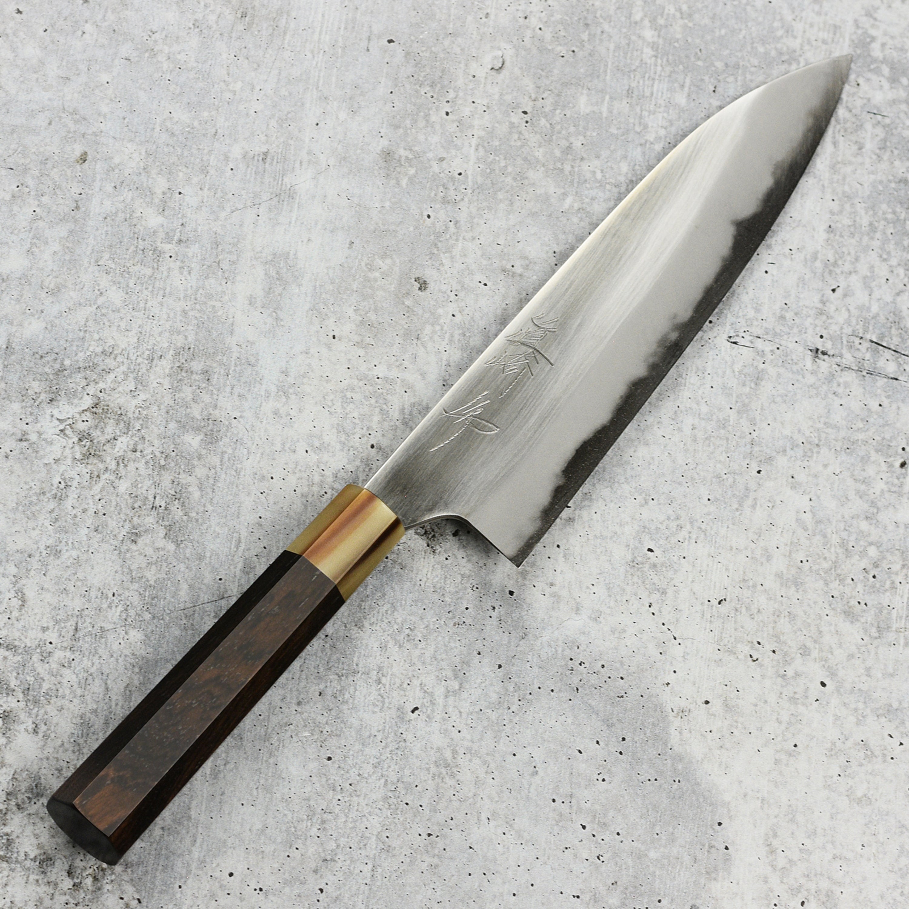 Close-up of the sharp edge of the Mazaki Shirogami Gyuto for detailed craftsmanship