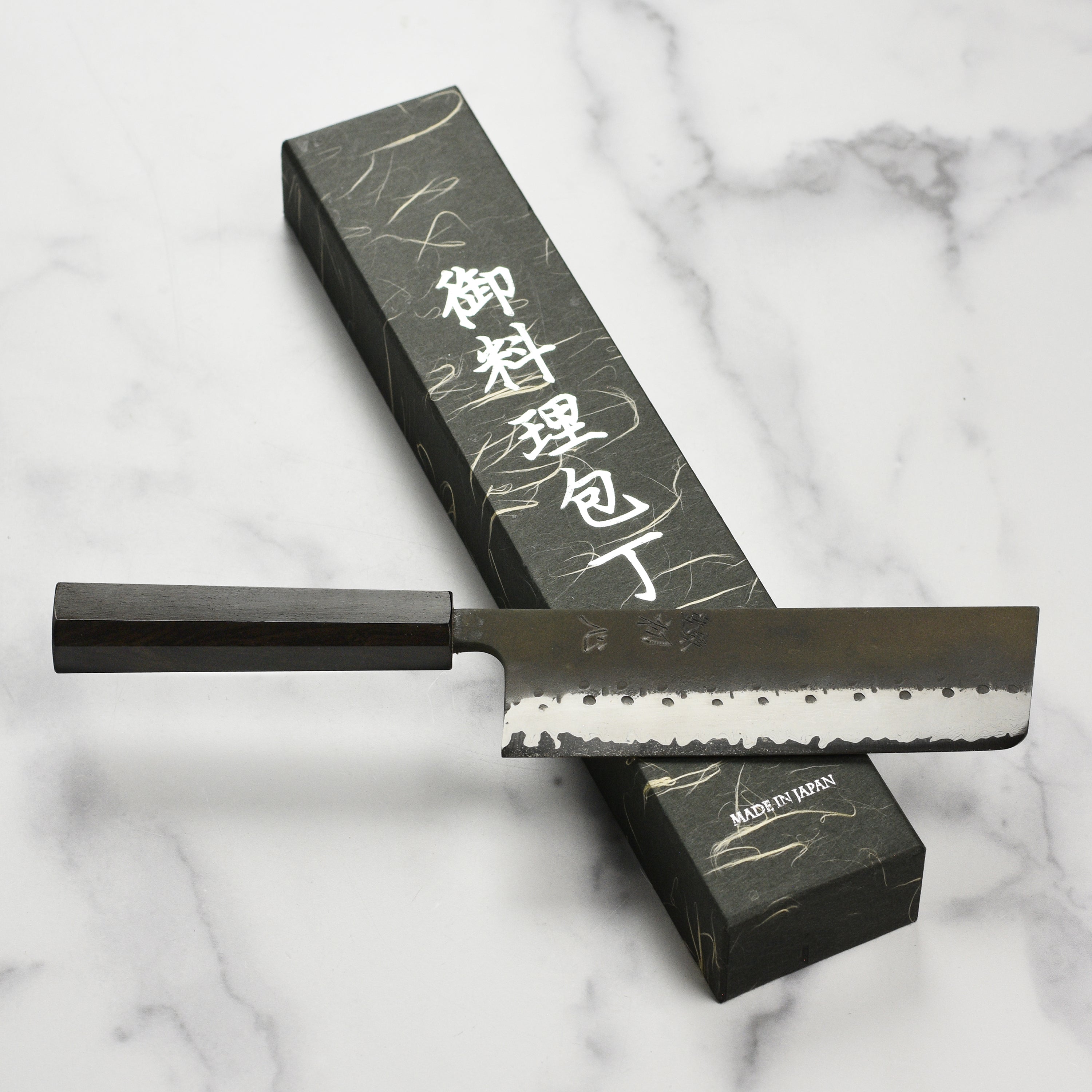 Hatsukokoro Damascus nakiri knife on cutting board for vegetable prep