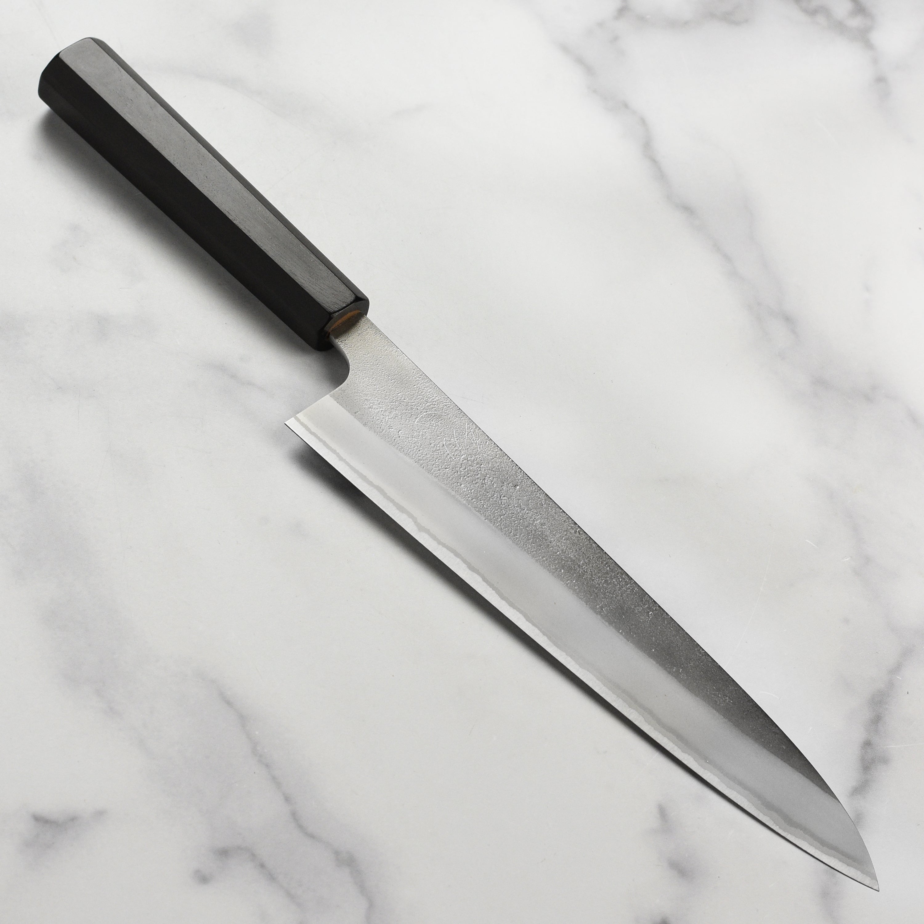 Yoshikane Shirogami #2 Nashiji gyuto chef knife with ebony handle, angled view