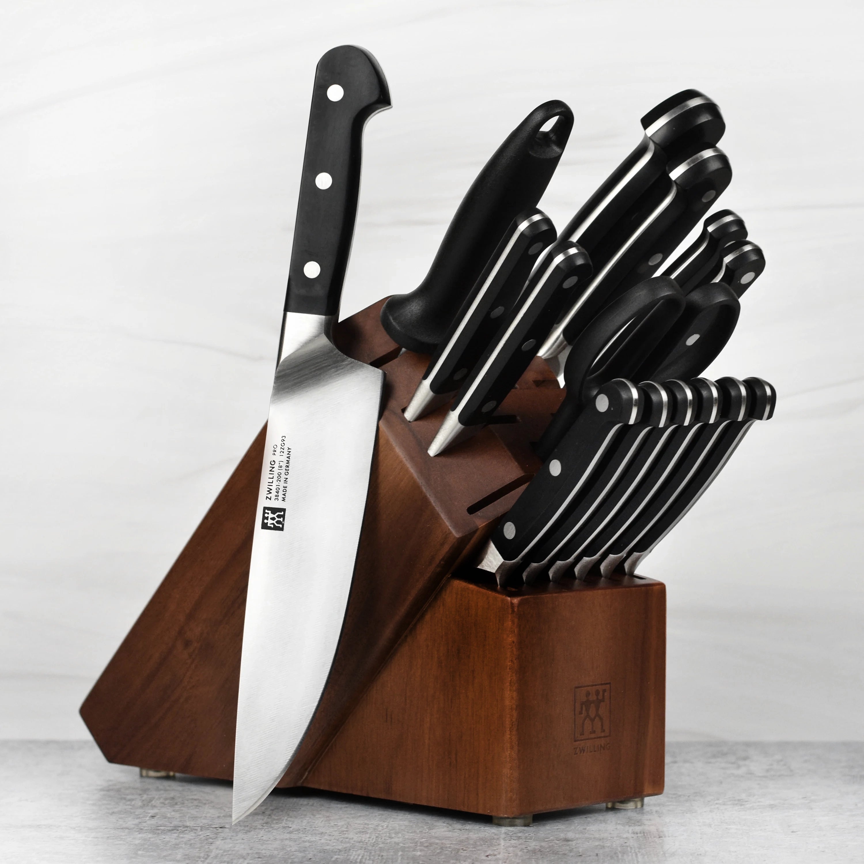 Elegant acacia knife holder showcasing kitchen knives and shears.