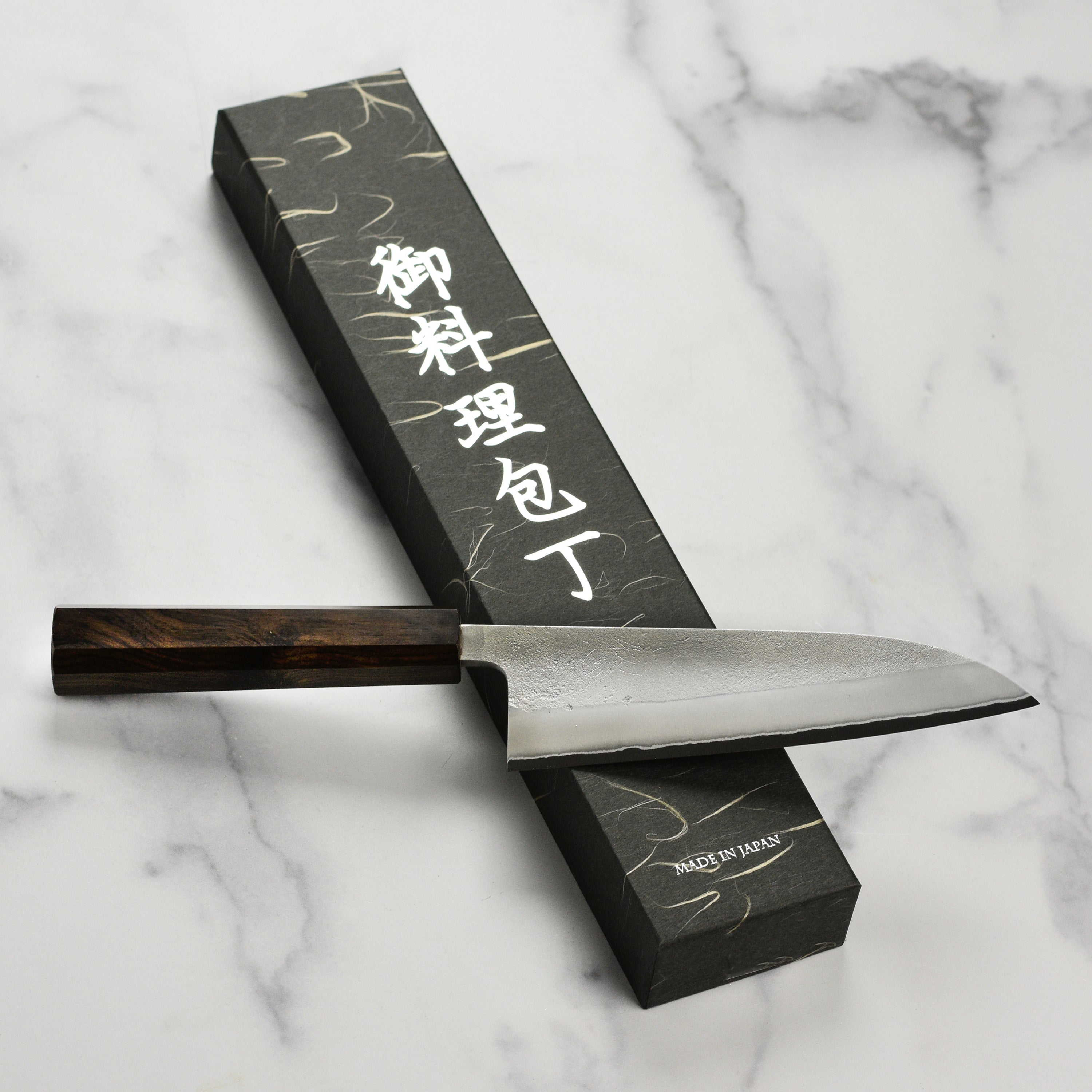 Japanese knife on a wooden cutting board demonstrating craftsmanship