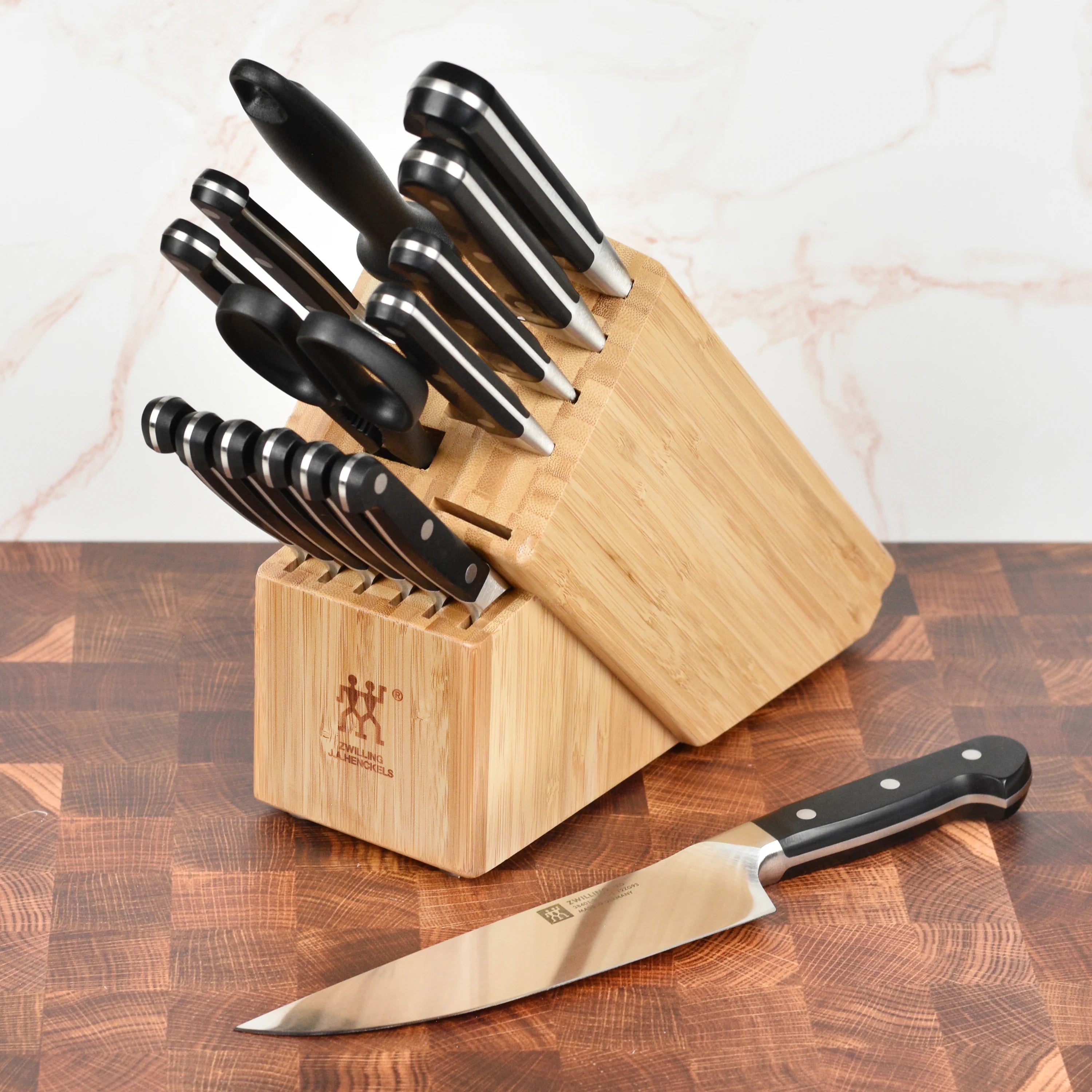 Close-up of the Zwilling Pro Bamboo Knife Block with knives securely placed, demonstrating the safety design.