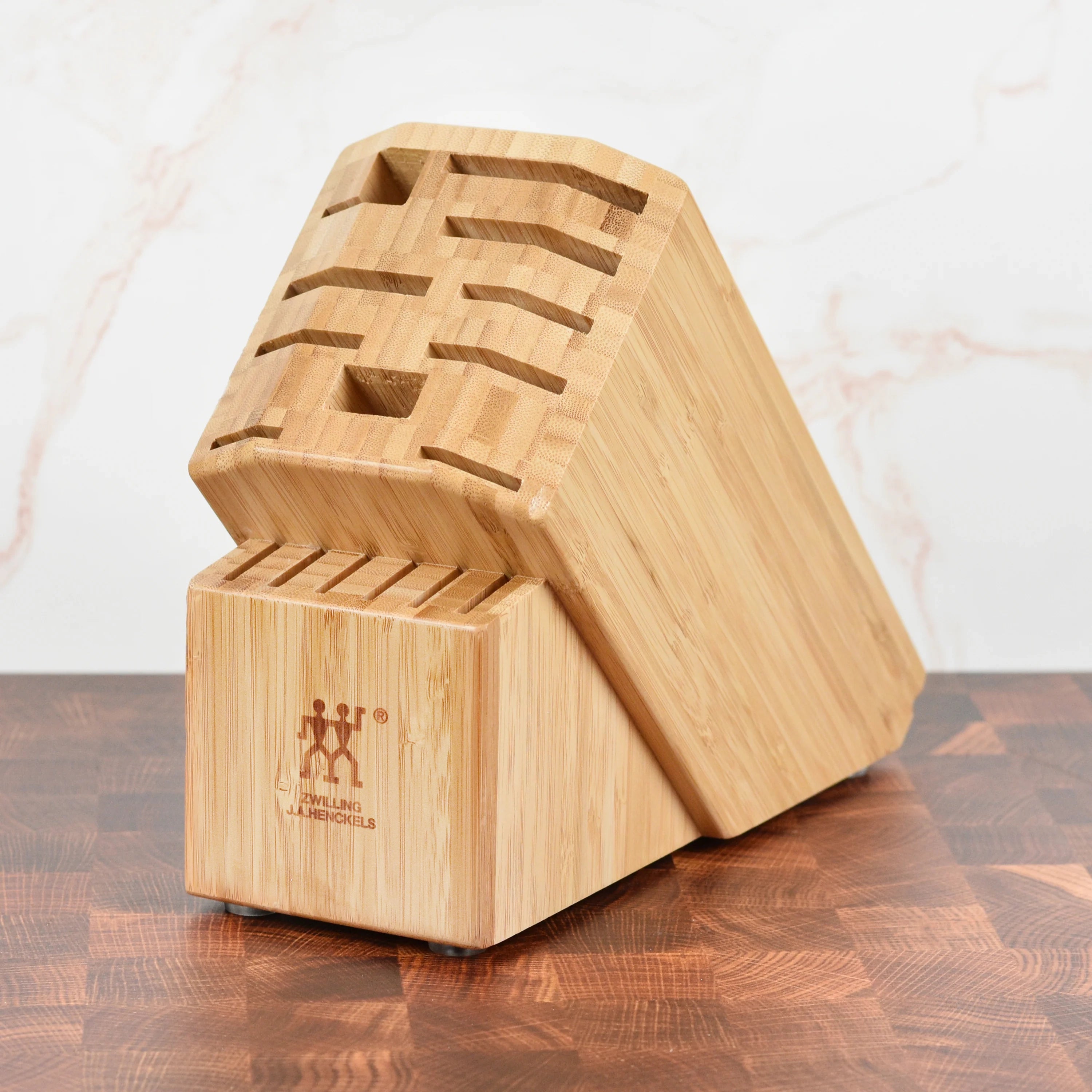 Front view of Zwilling Pro bamboo knife block showing the 16 knife slots, ideal for kitchen storage.