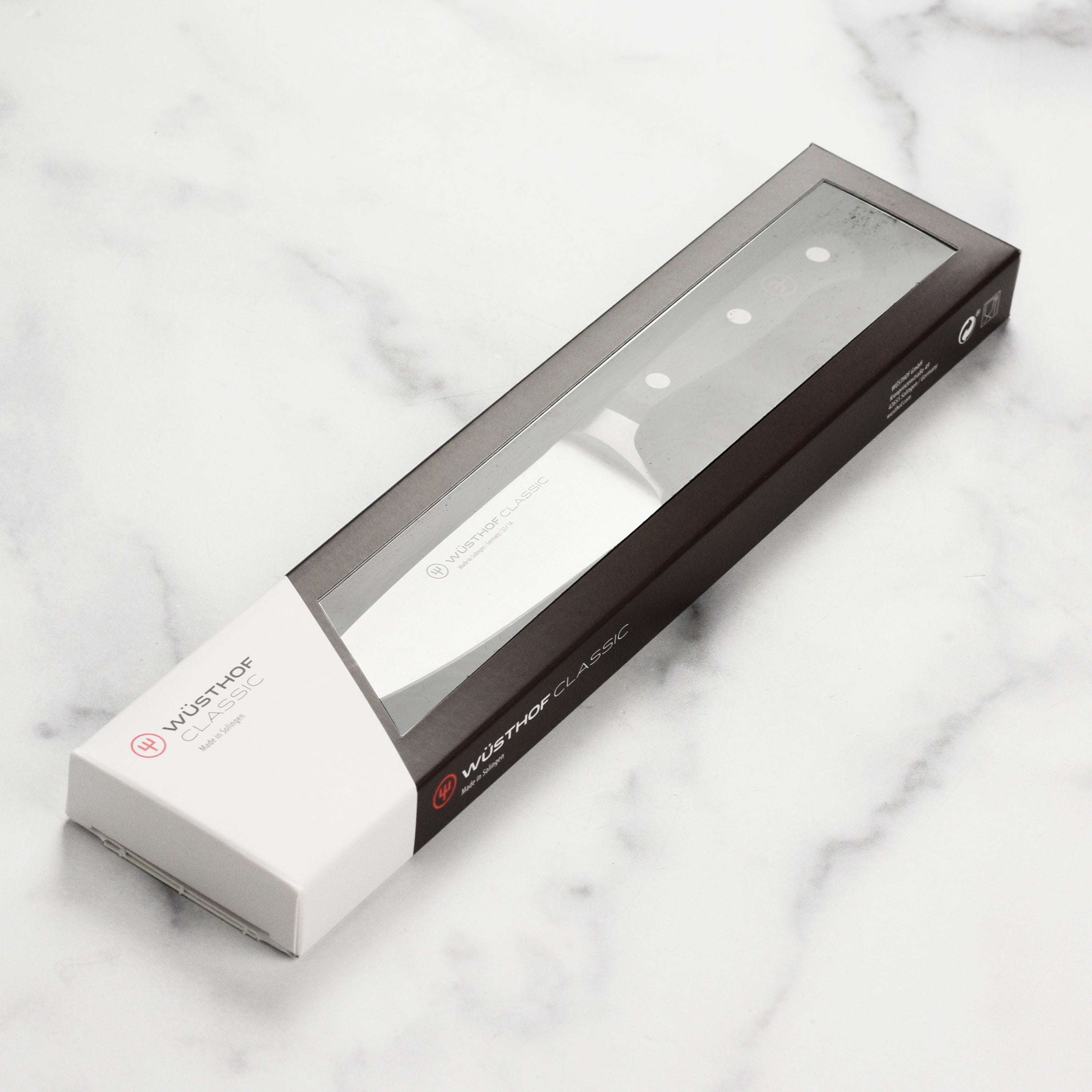 Wusthof Classic 5-inch chefs knife with a sharp stainless steel blade and ergonomic handle