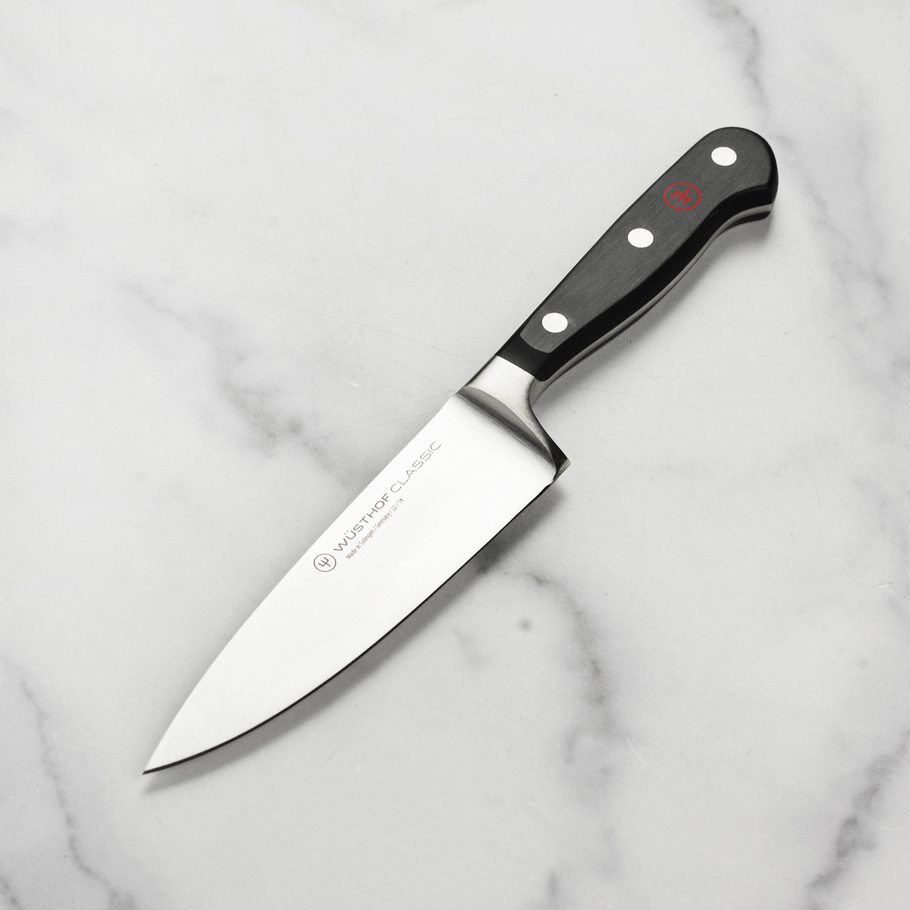 Wusthof Classic 5-inch chef's knife with a sharp stainless steel blade and ergonomic handle