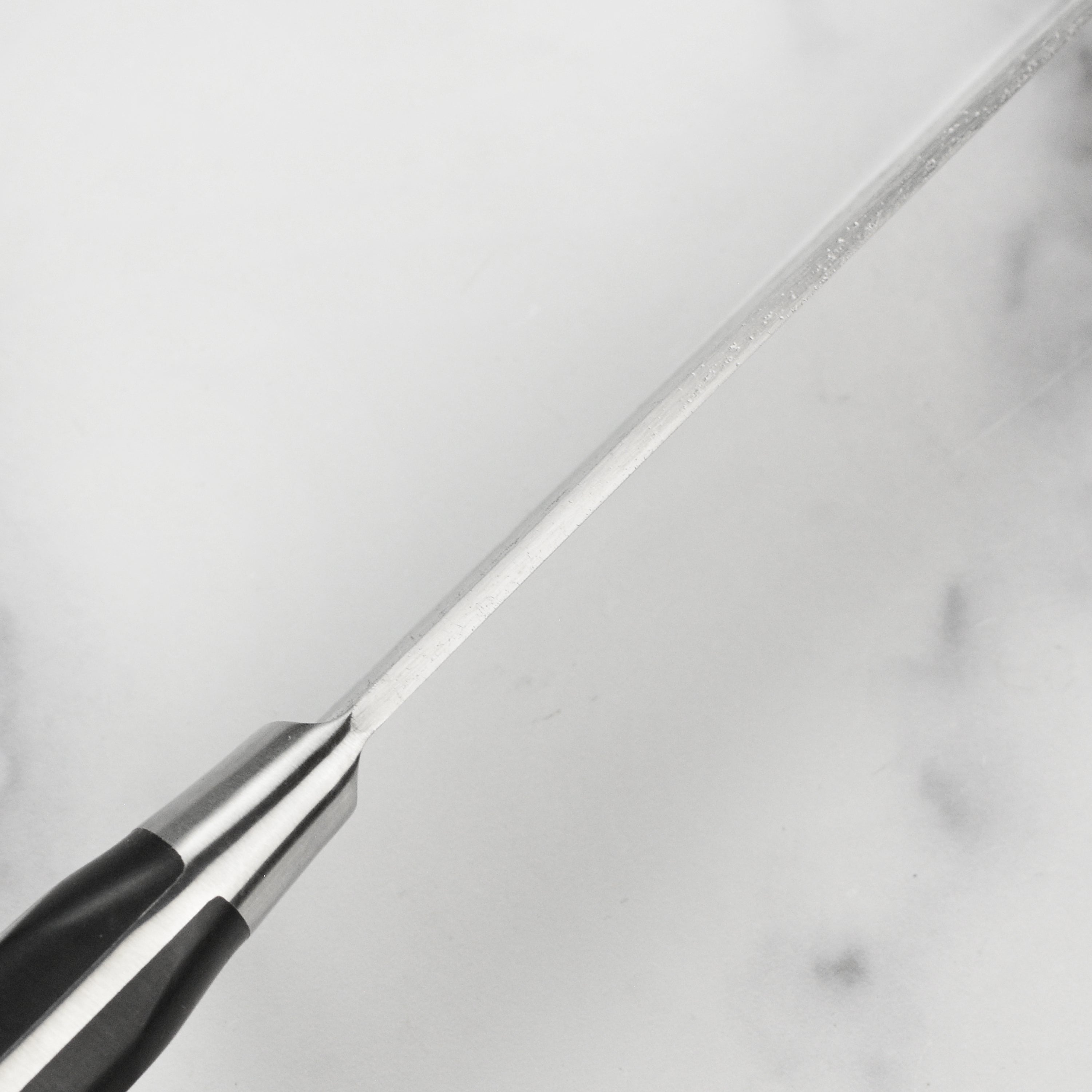 Full view of the K Sabatier Au Carbone 9 inch chefs knife showcasing its elegant French style bolster