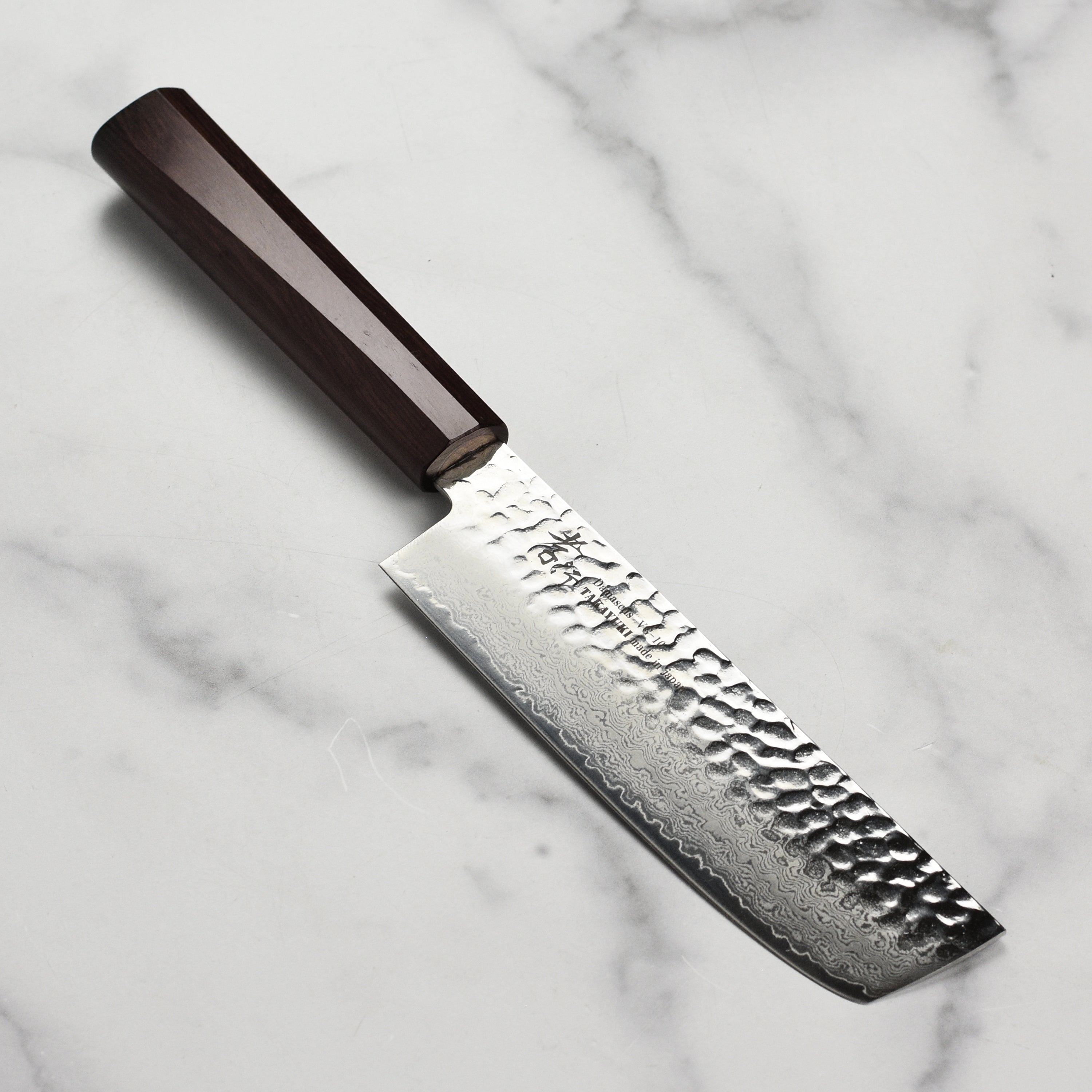 Takayuki Tsuchime Nakiri Knife showcasing its elegant design and sharp blade.