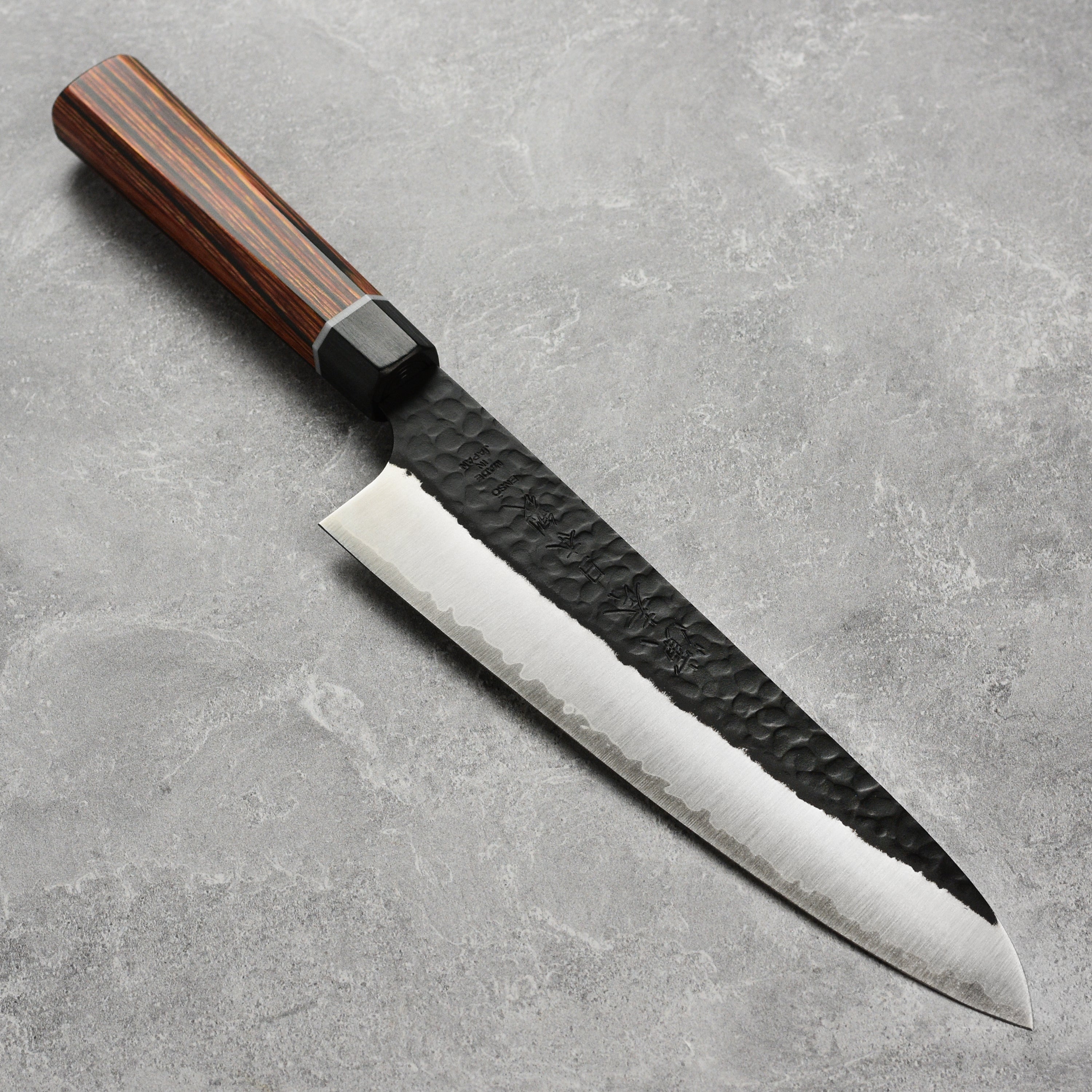 Front view of the Enso Hachi SG2 Gyuto showing hammered blade and pakkawood handle