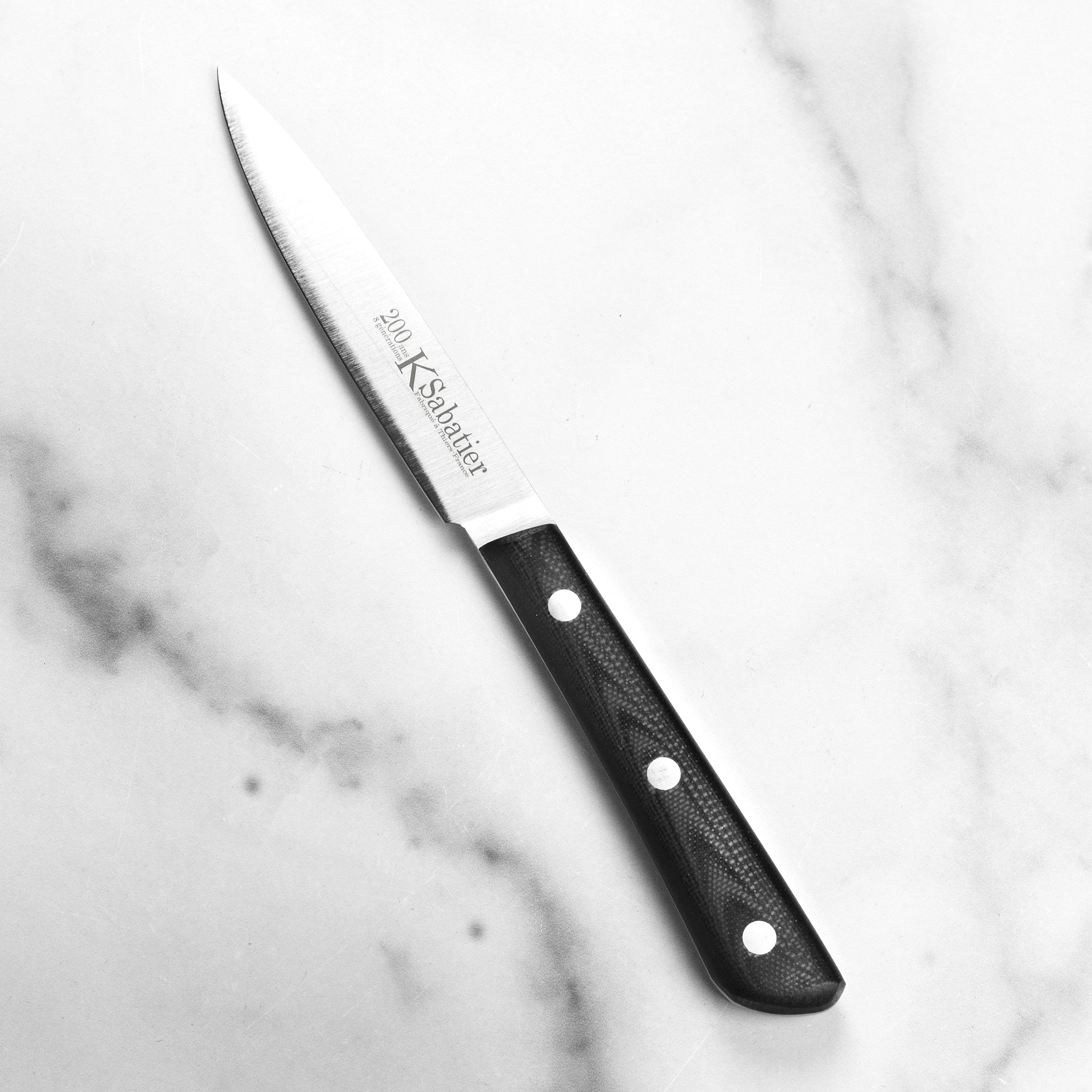 Kitchen setup with the Sabatier paring knife and leather sheath for storage
