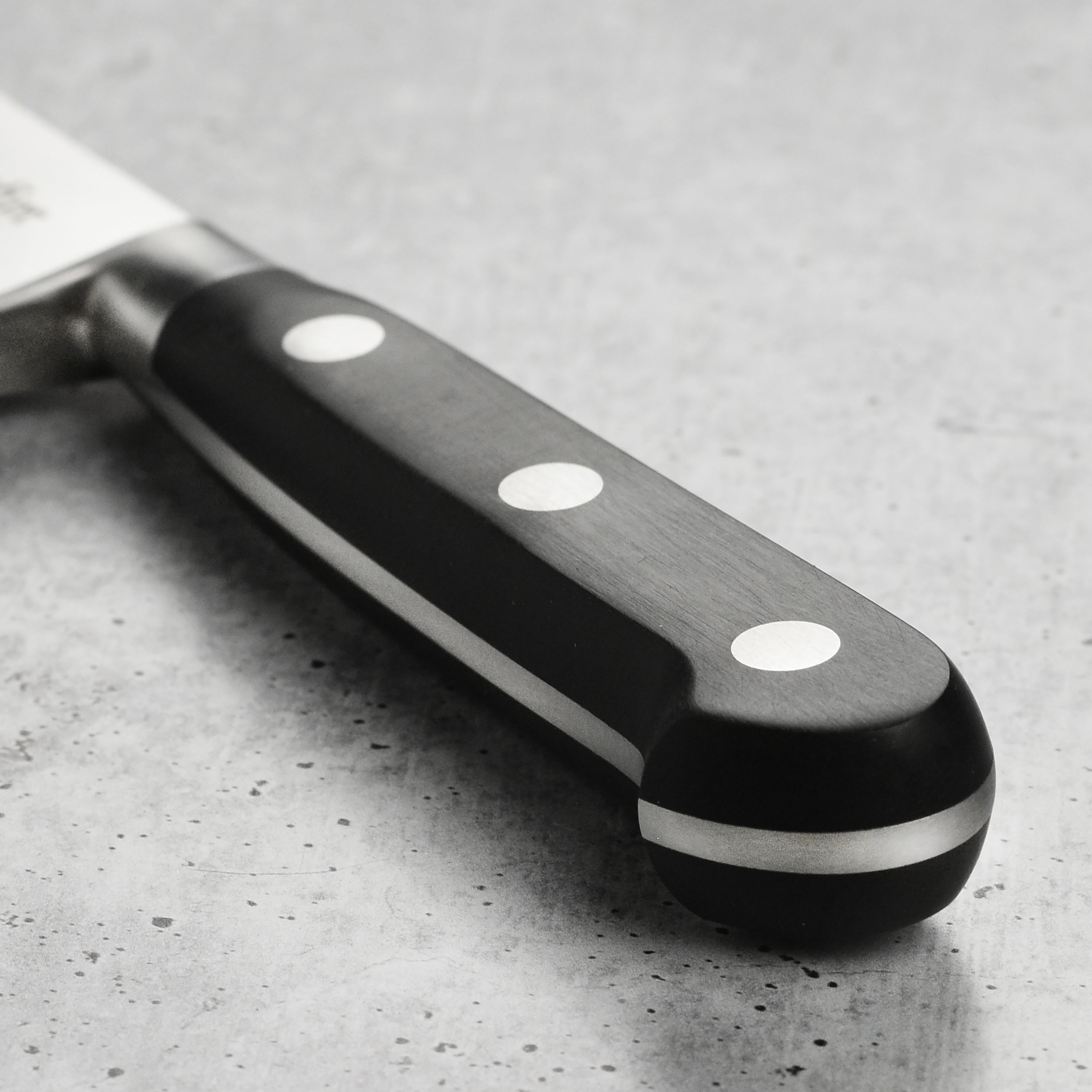 Close-up showing cryogenically hardened blade and Sabatier engraved logo on 10-inch kitchen knife