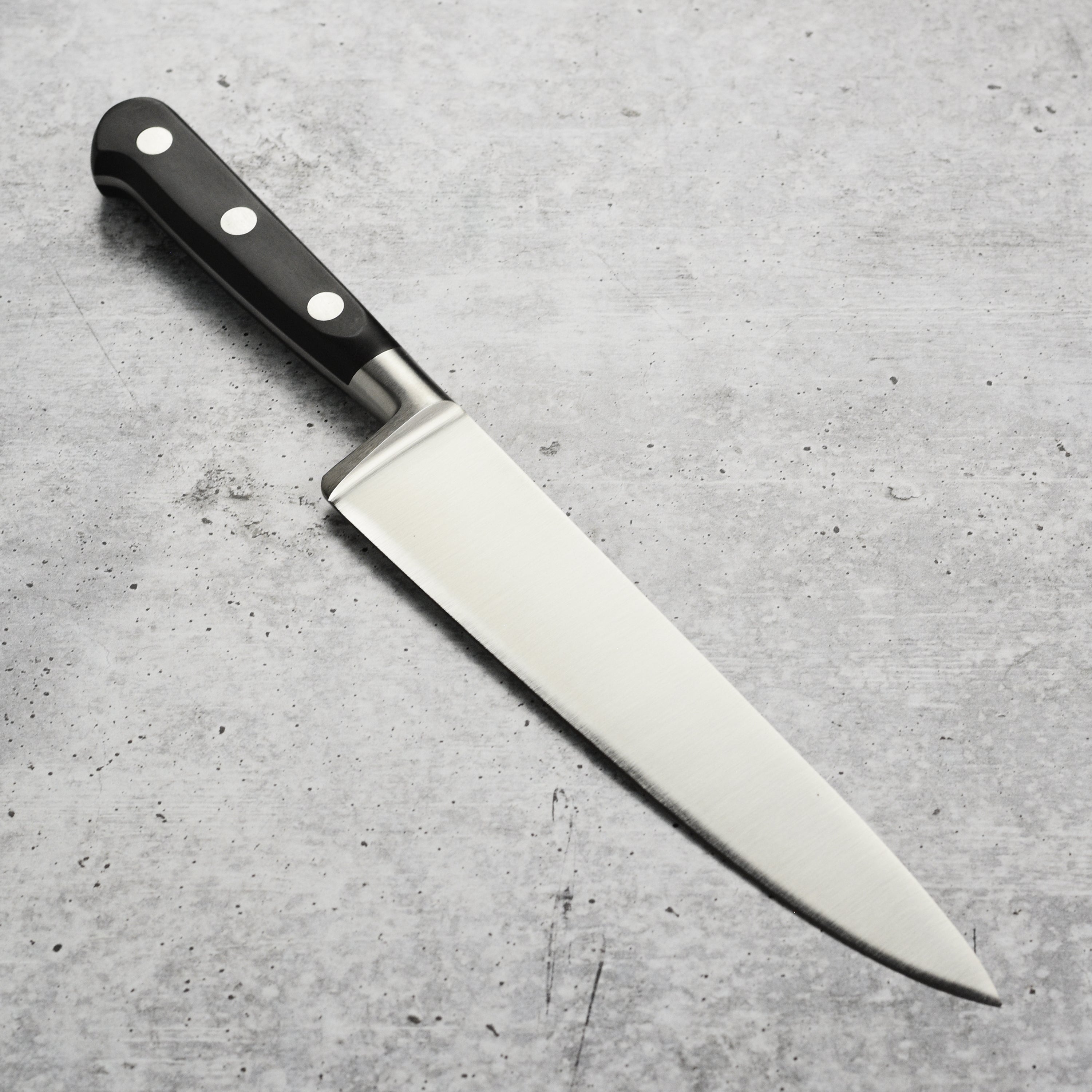 K Sabatier Authentique 1834 Limited Edition 8" Chefs Knife displayed with its brown leather sheath.