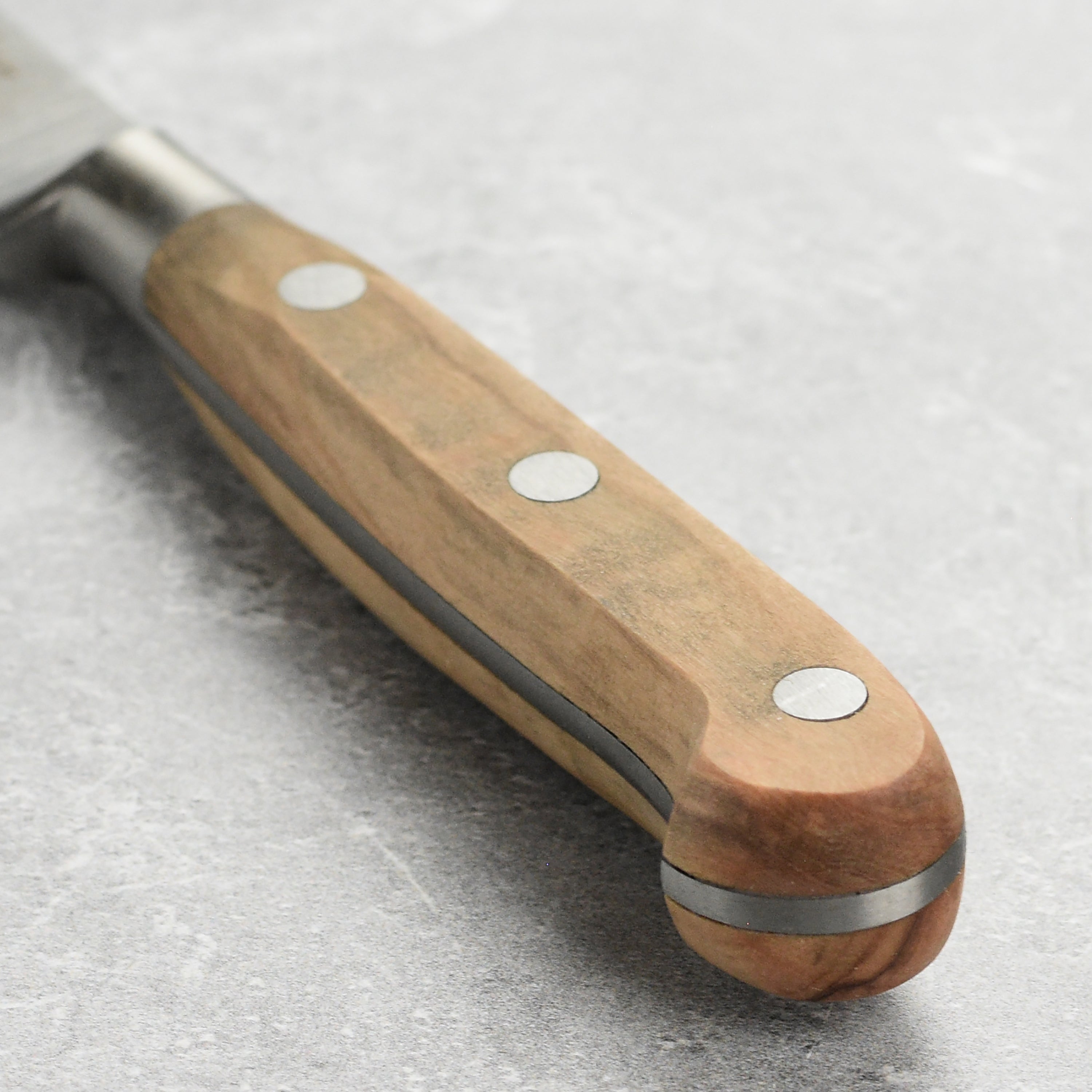 Premium tomato knife for chefs slicing ripe tomatoes on a wooden cutting board