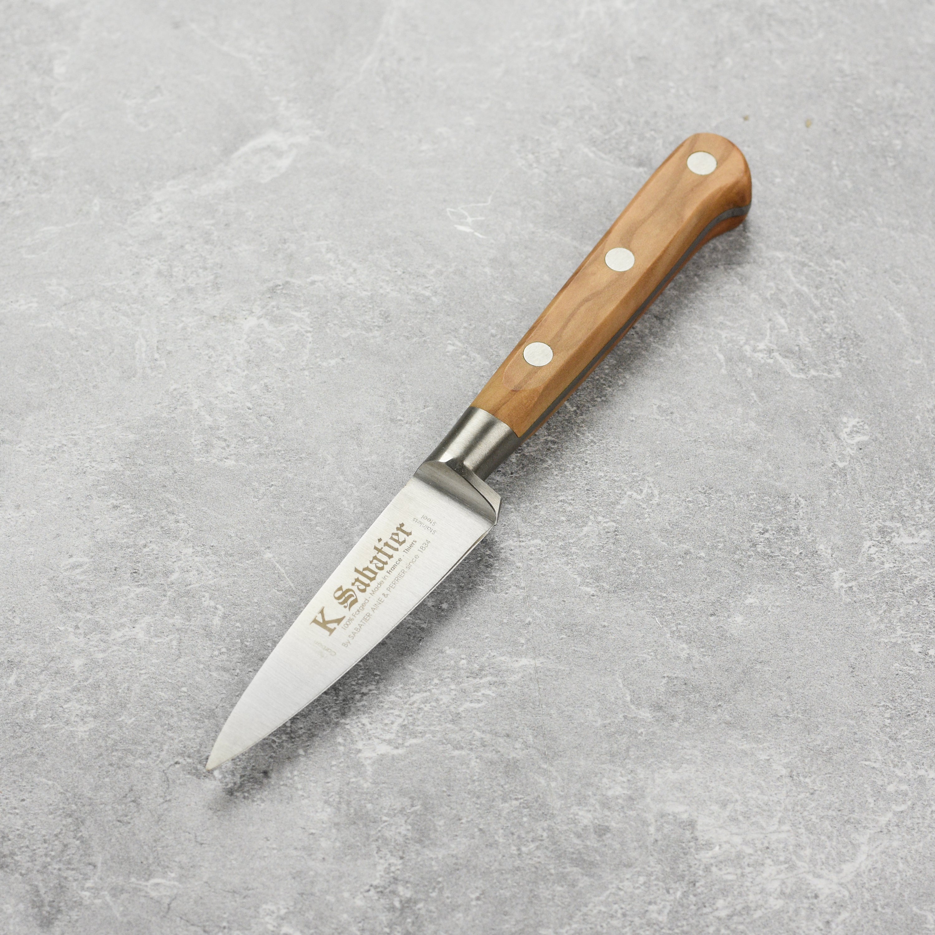 K Sabatier Olive Wood Paring Knife showcasing its sleek design and olive wood handle.