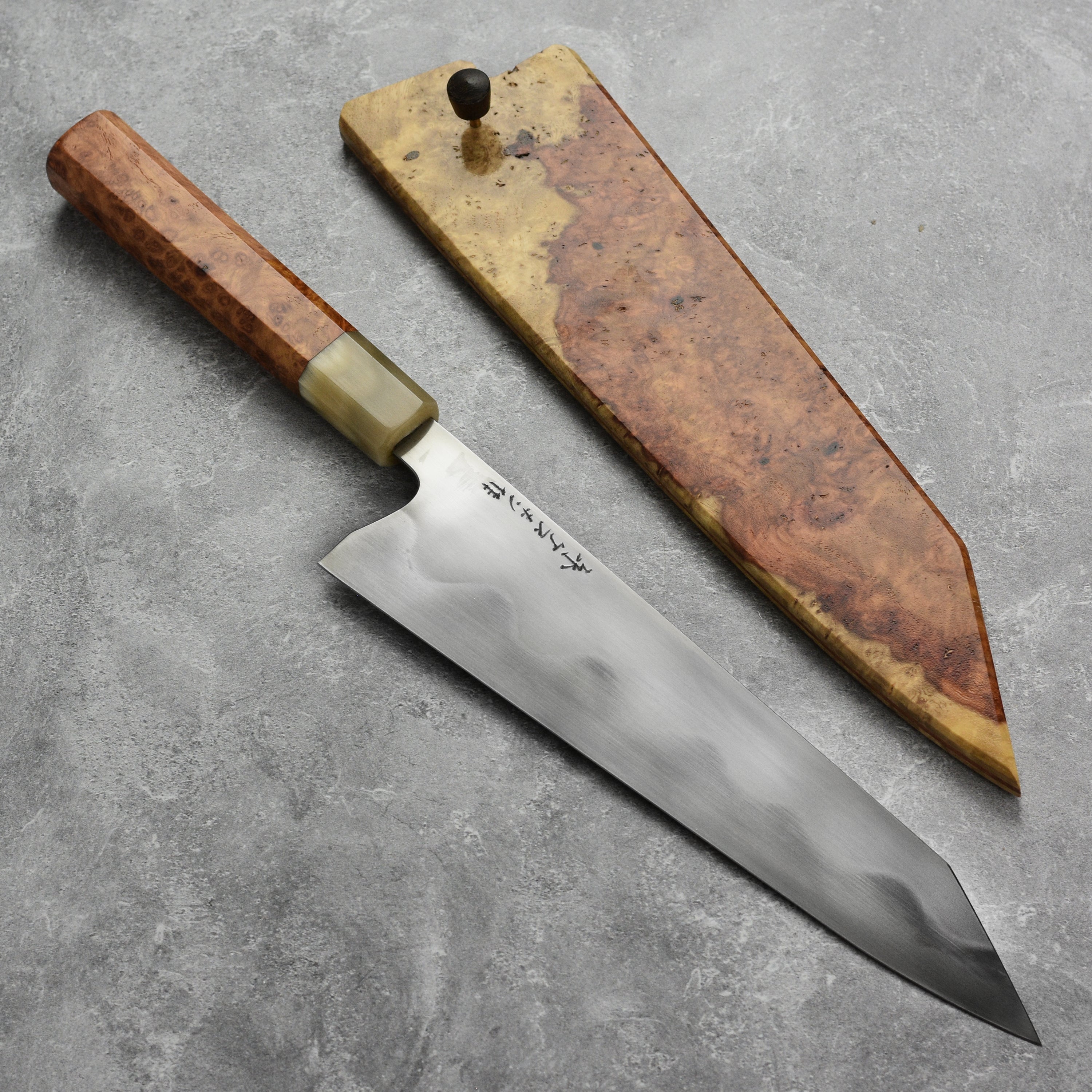 Keskin 9-inch Japanese chef knife with saya, angled view highlighting the blade's sharpness