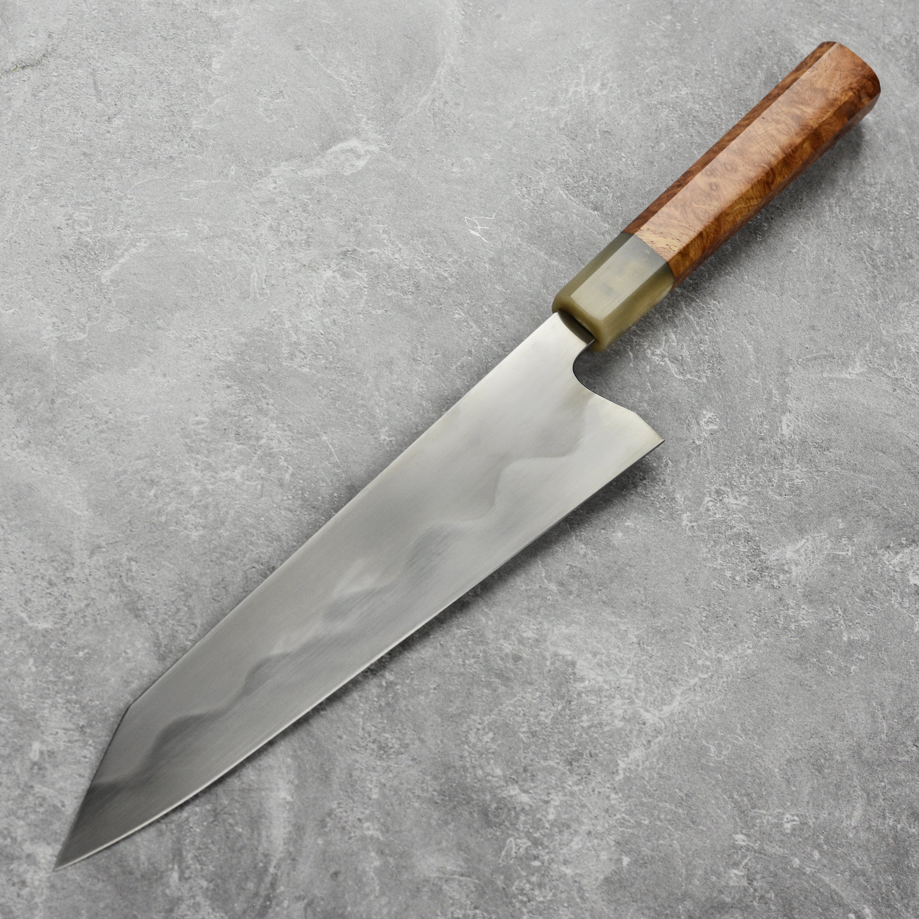Keskin 9-inch Japanese chef knife with saya, angled view highlighting the blades sharpness