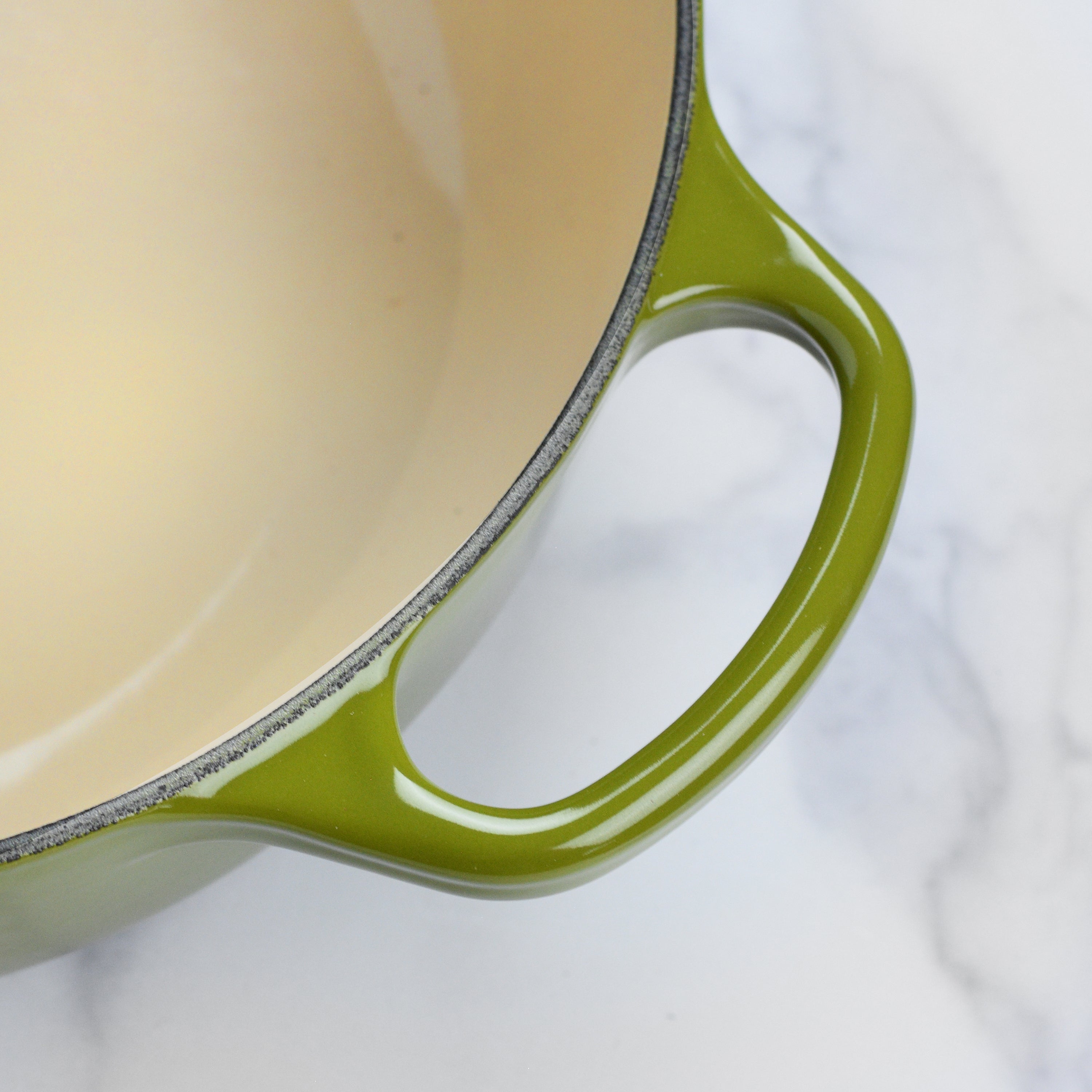 Le Creuset 3.5-quart cast iron sauteuse with ergonomic handles and gold knob