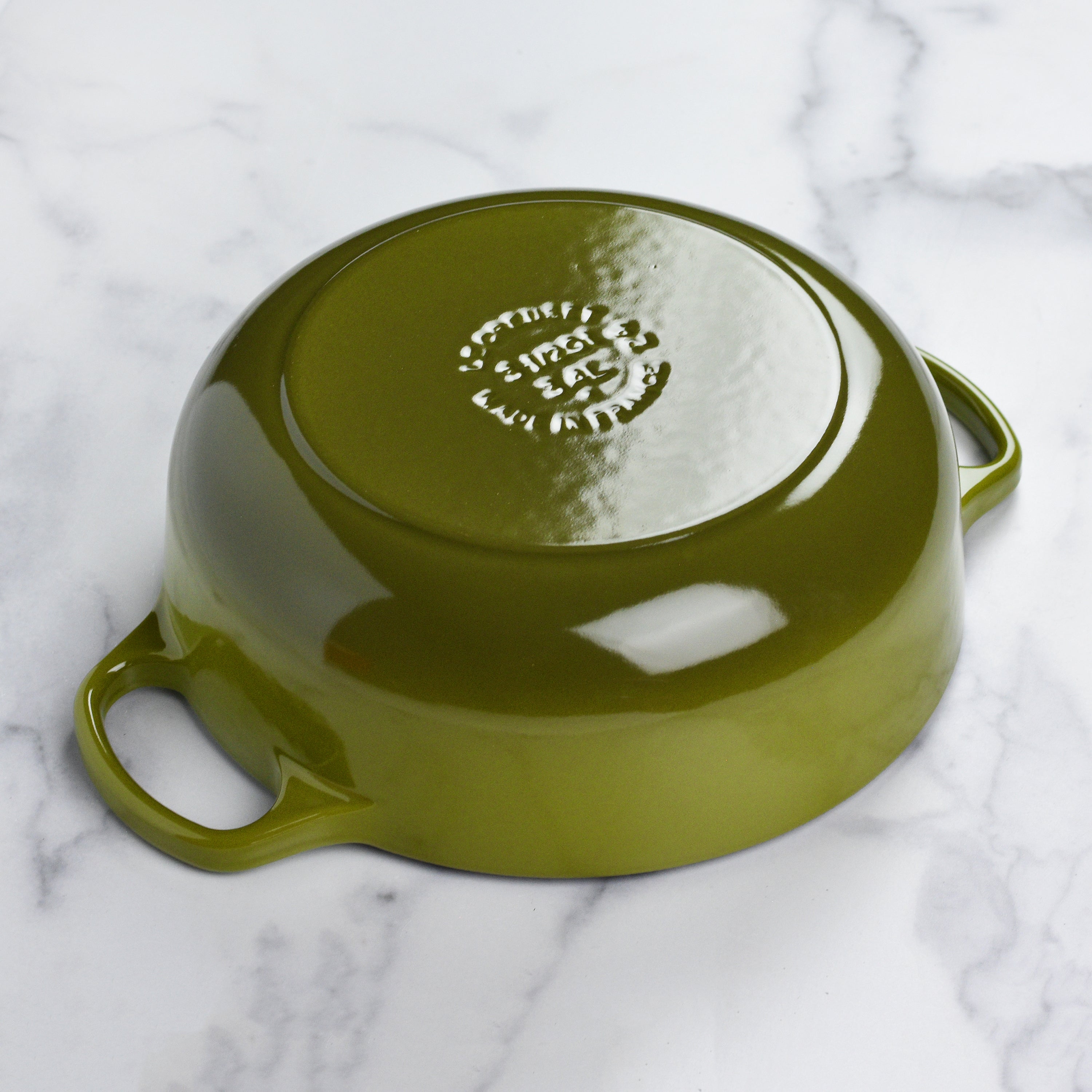 Le Creuset 3.5-quart cast iron sauteuse with ergonomic handles and gold knob