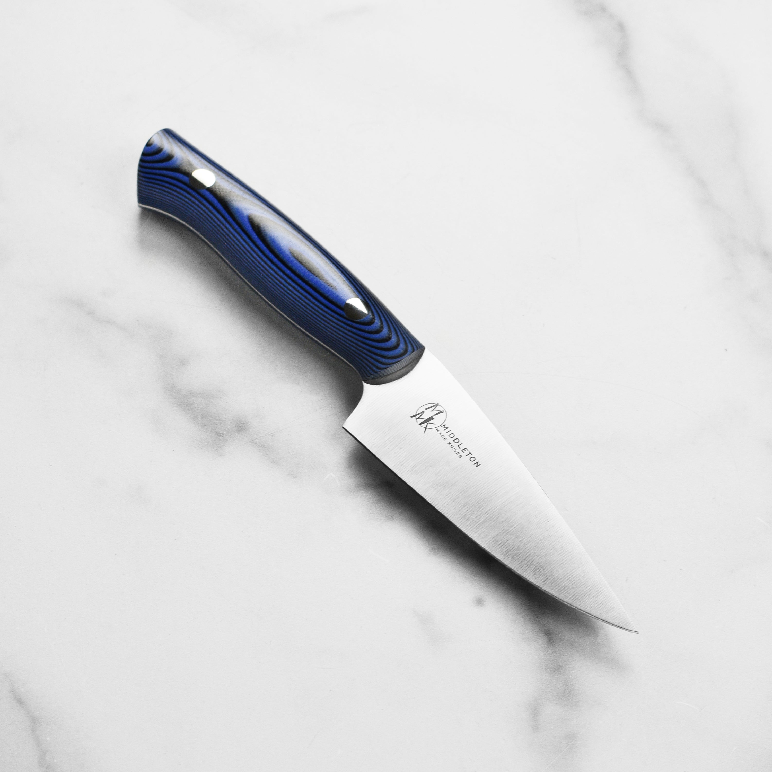 Close-up of Middleton Echo 4-inch paring knife showing sharp stainless steel blade and ergonomic handle