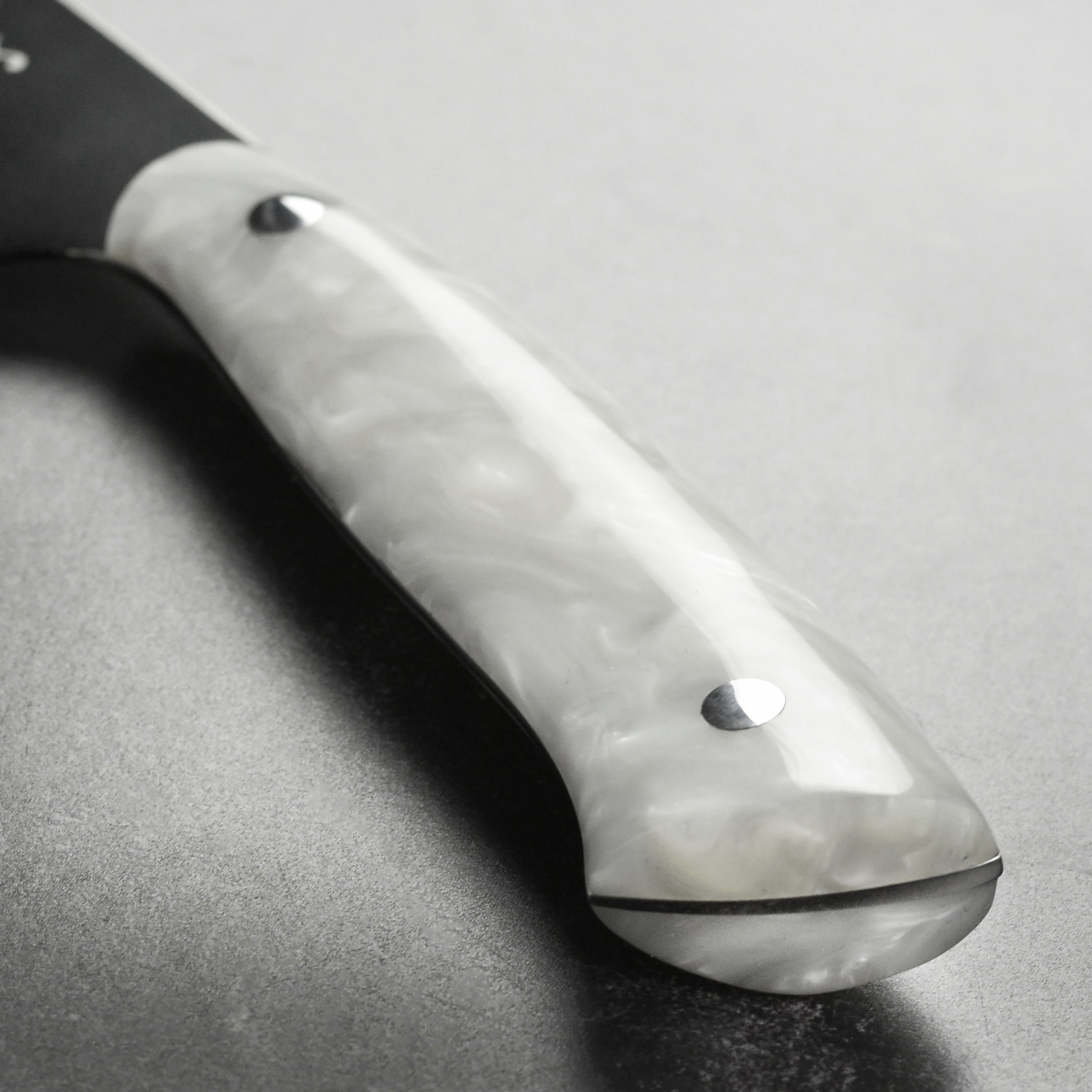 Chef slicing vegetables with Middleton Pearl Echo professional kitchen knife