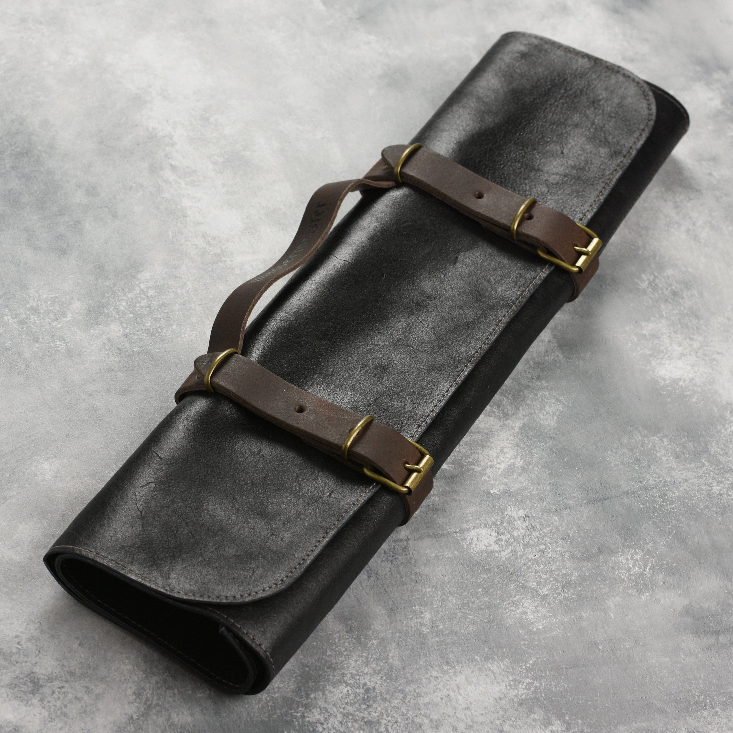 Vintage leather knife roll showcasing its soft texture and spacious pockets for knife storage.
