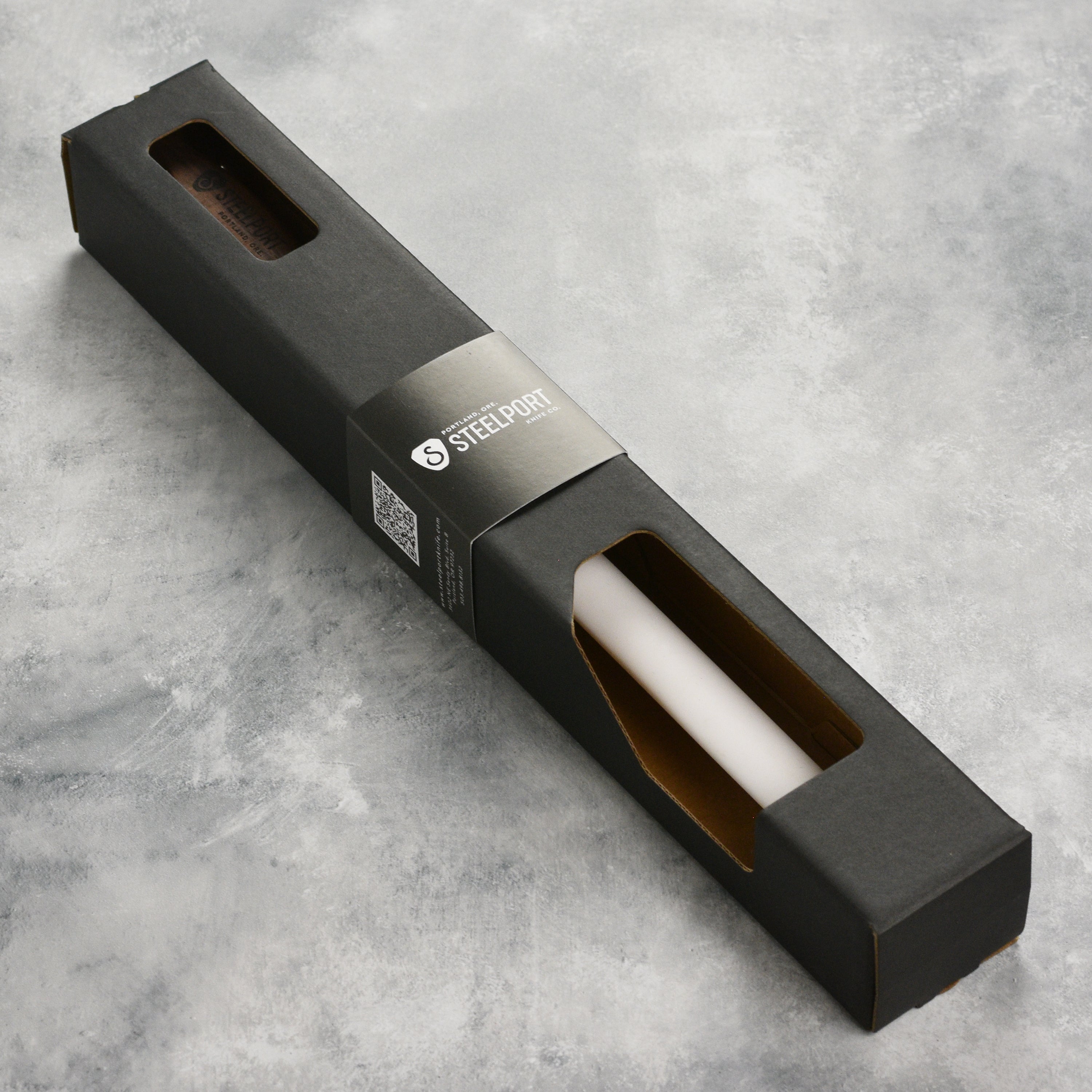 User  demonstrating the Steelport professional grade ceramic knife sharpener with a kitchen knife.