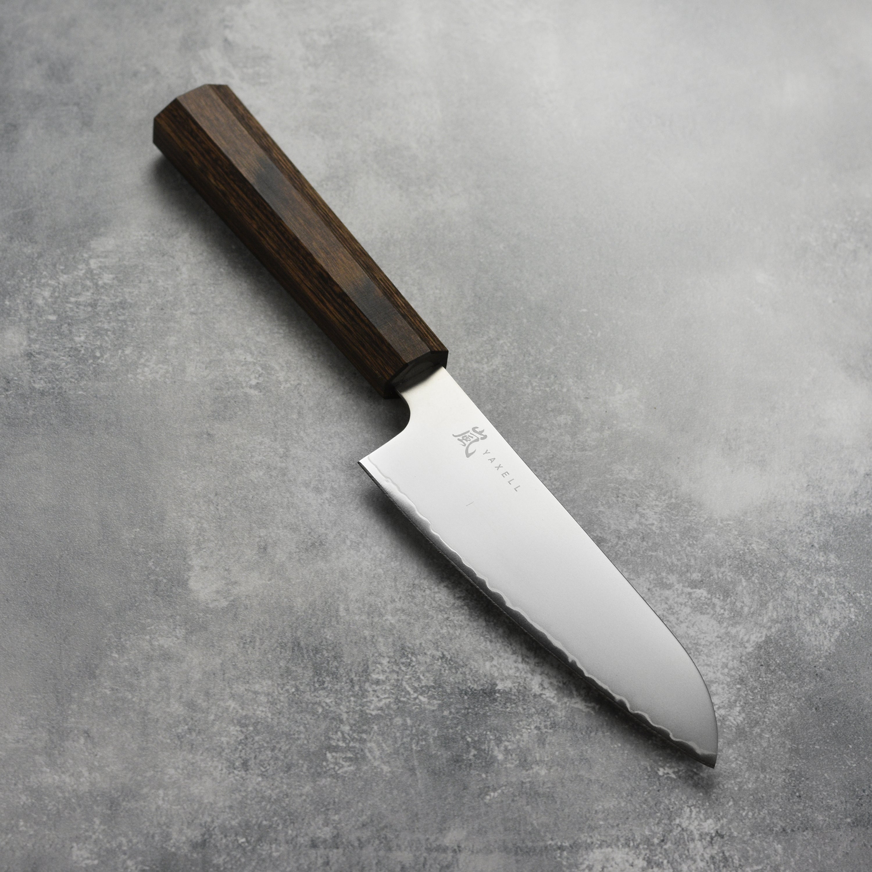 Yaxell Hana Santoku knife from above, highlighting the blade and handle design.