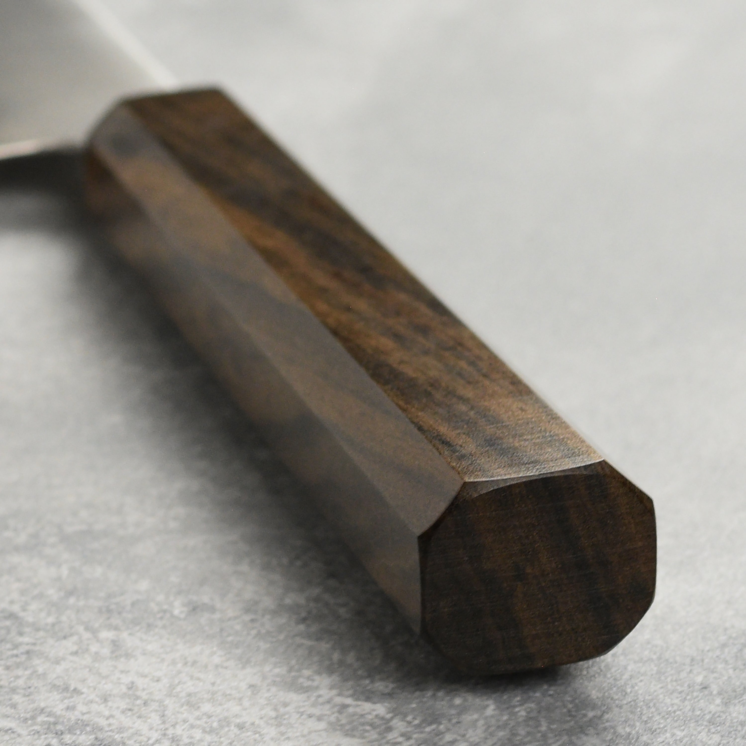 Close-up of the sharp edge of the HAP40 Gyuto knife, perfect for home cooks.