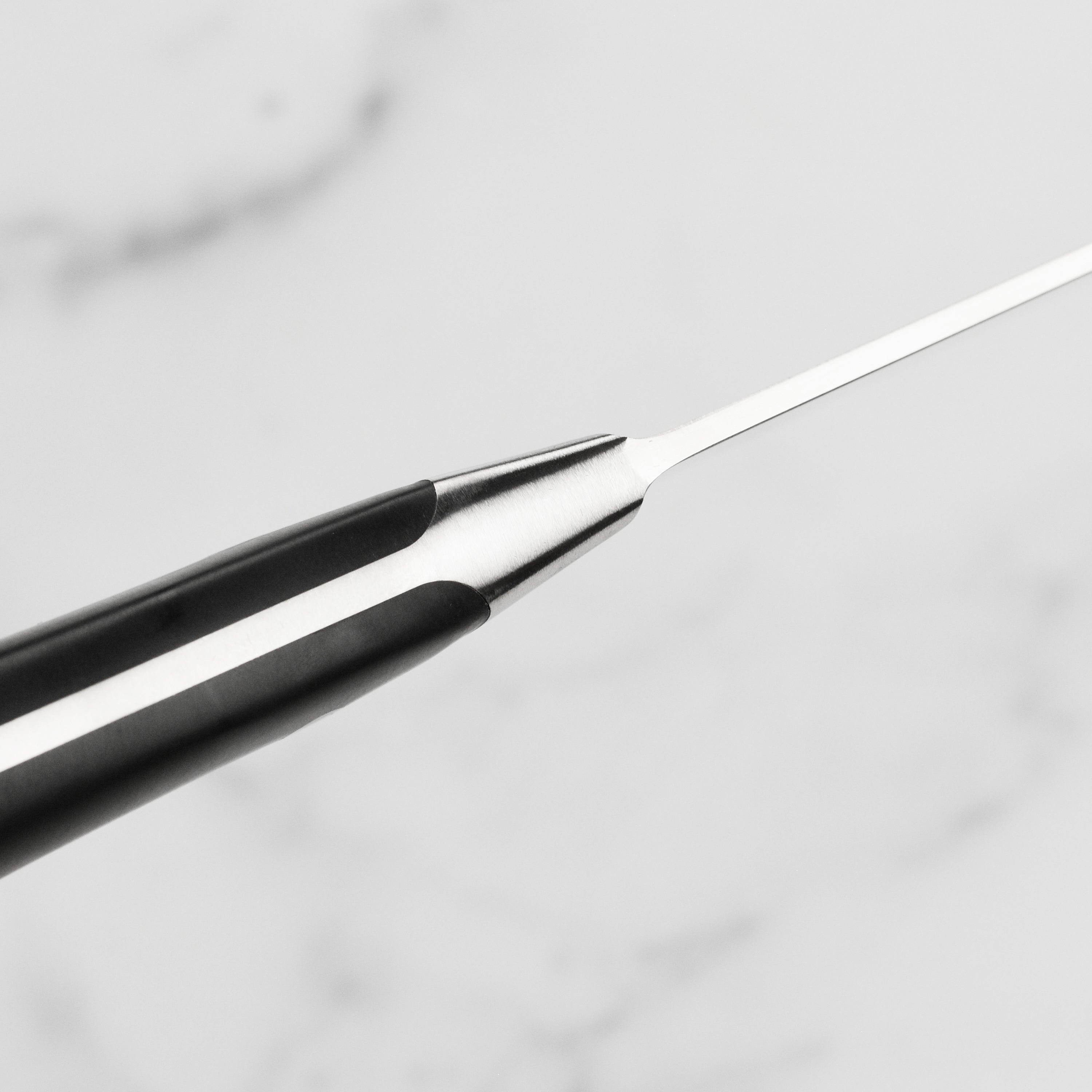 Side view of the Wusthof Classic Ikon 10" High-Carbon Kitchen Slicer highlighting its ergonomic handle.