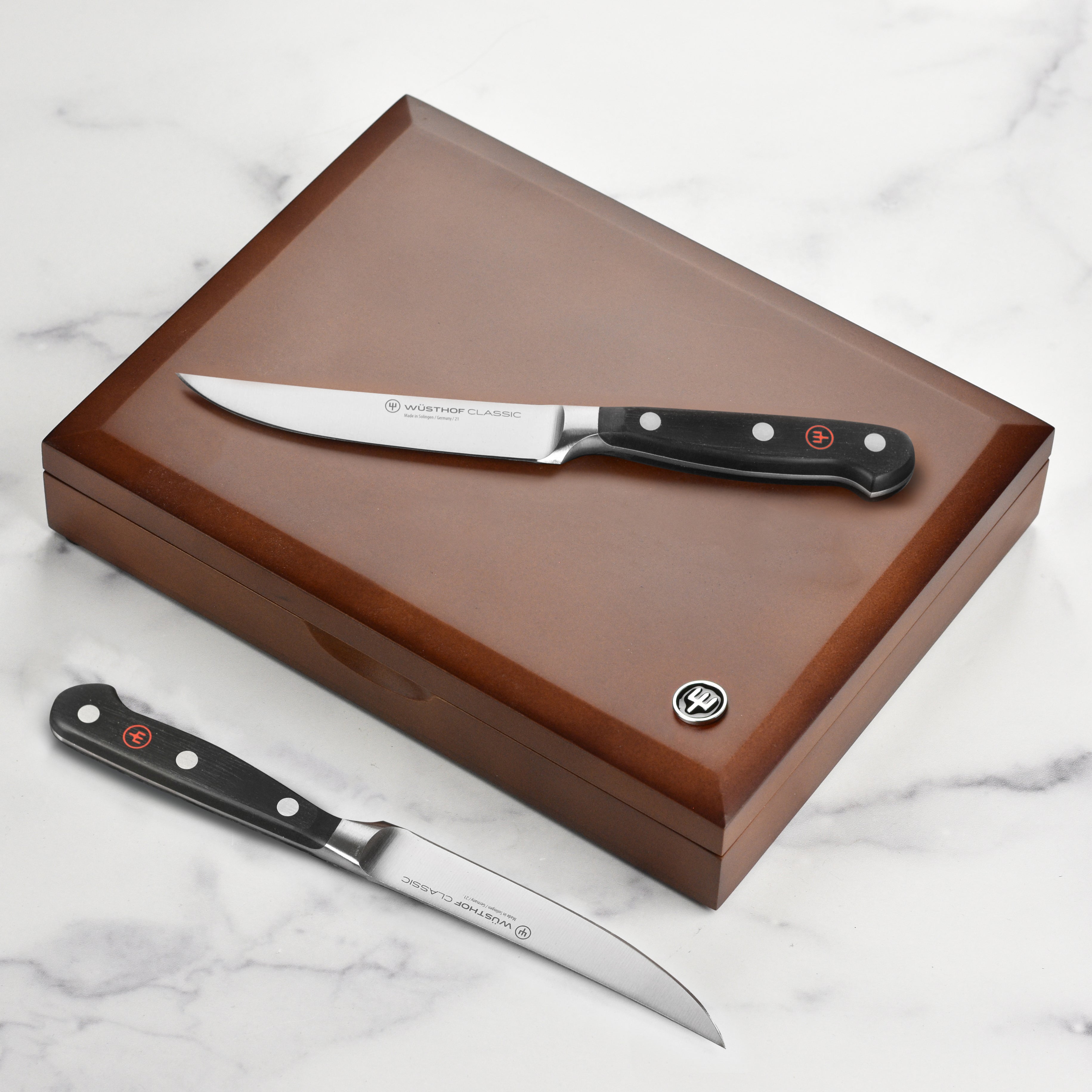 Wusthof steak knife set displayed beautifully on a dining table, perfect for high-quality dining.