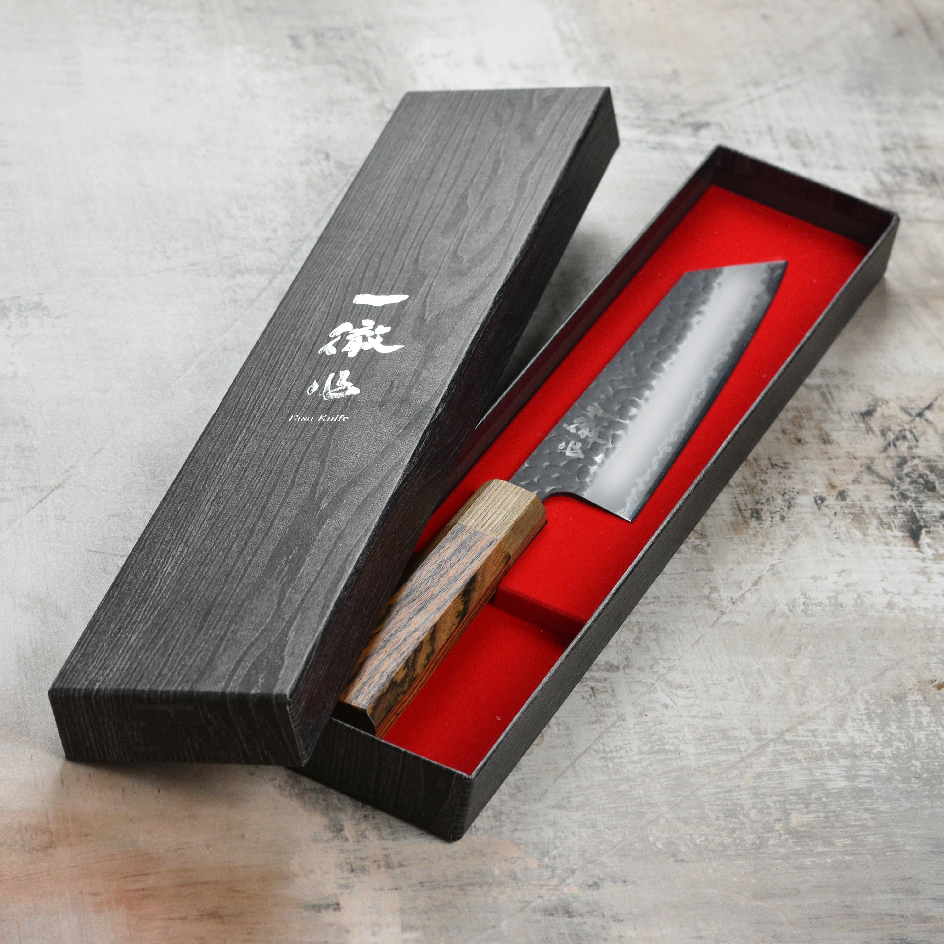 Ittetsu Aogami Super Kurouchi 6.7" Bunka Knife from a top angle, highlighting its sharp blade and grip.