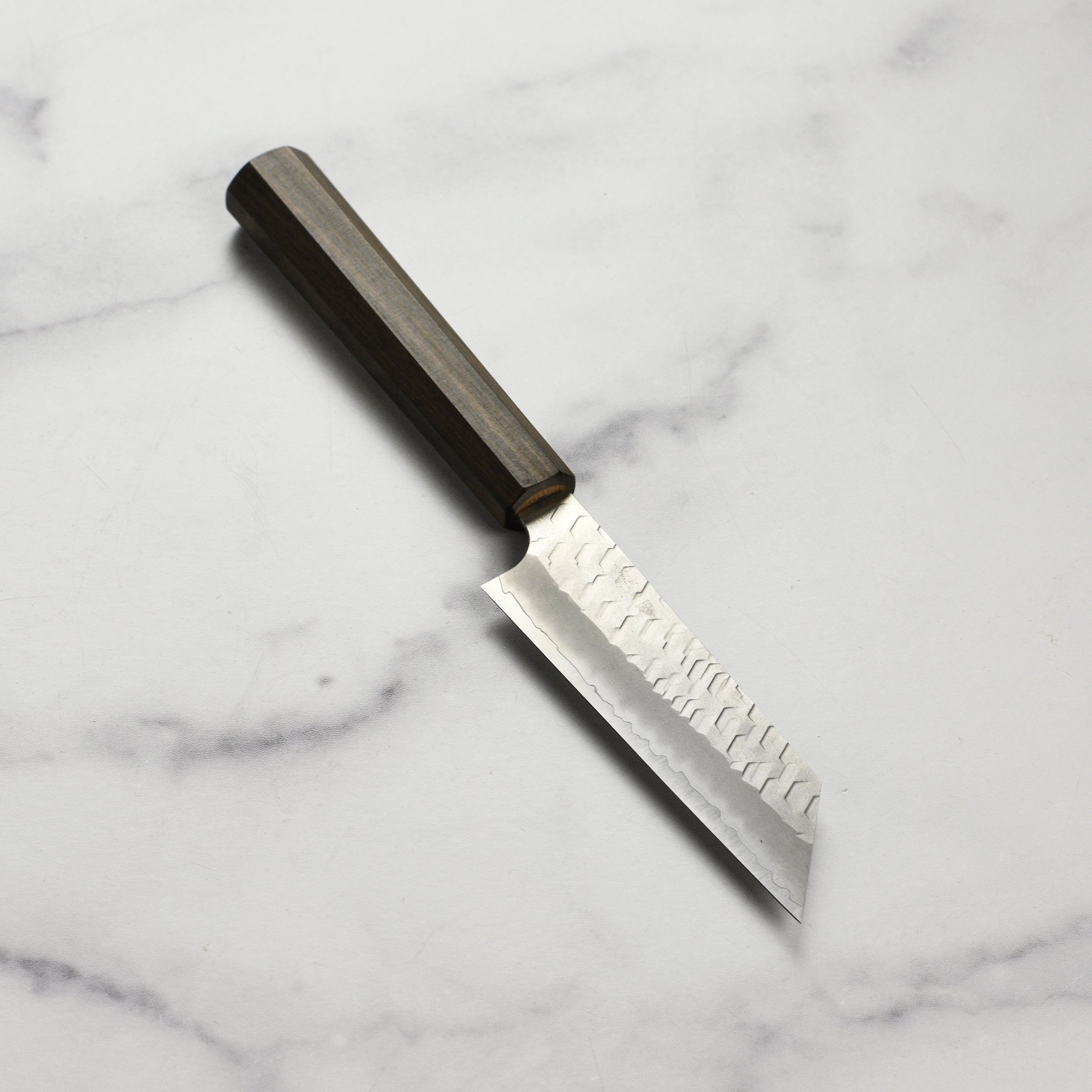Nigara Kiritsuke Paring Knife showcasing its sharp blade and ergonomic handle, perfect for home chefs.