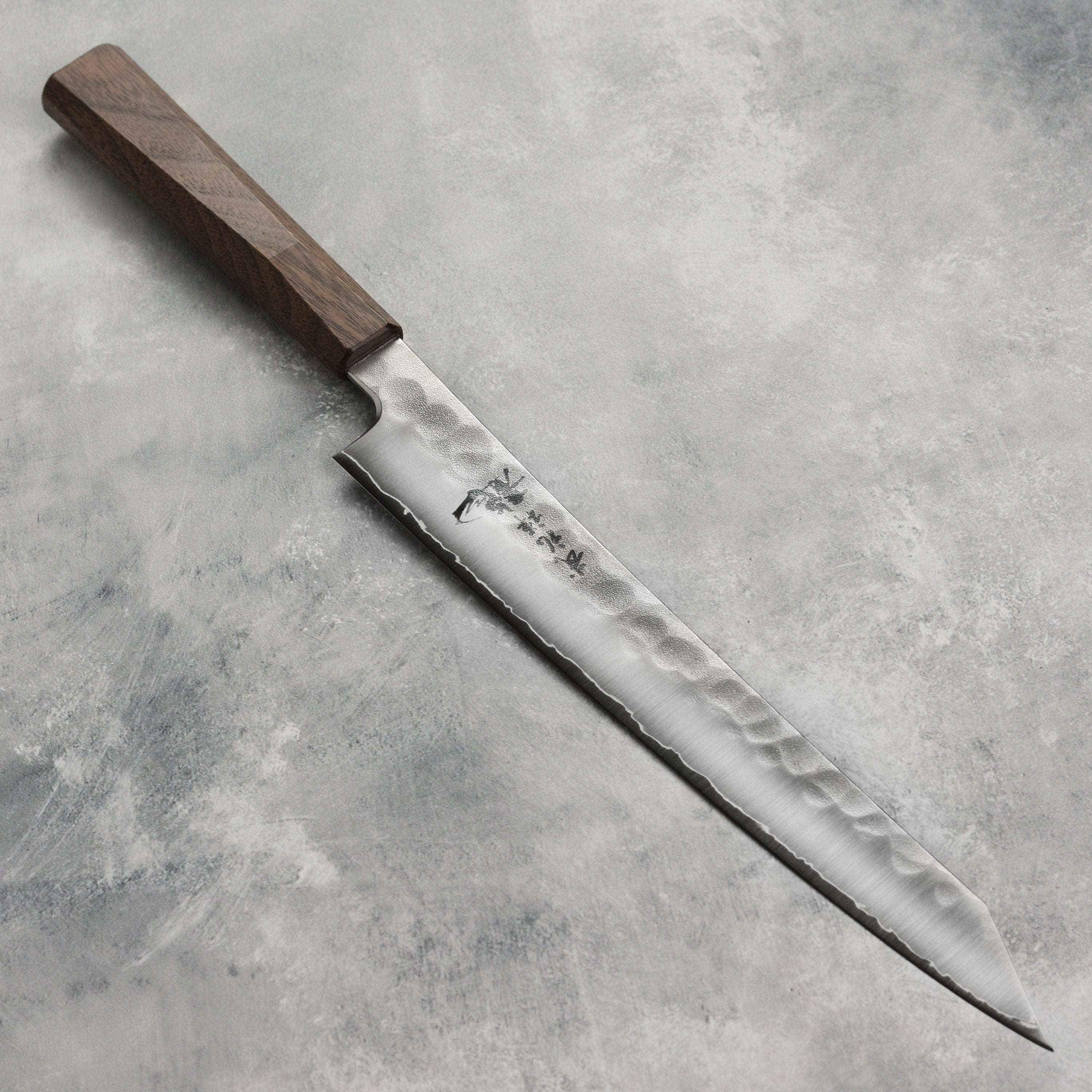 Sushi chef using the Ryusen Blazen Ryu Wa SG2 10.25