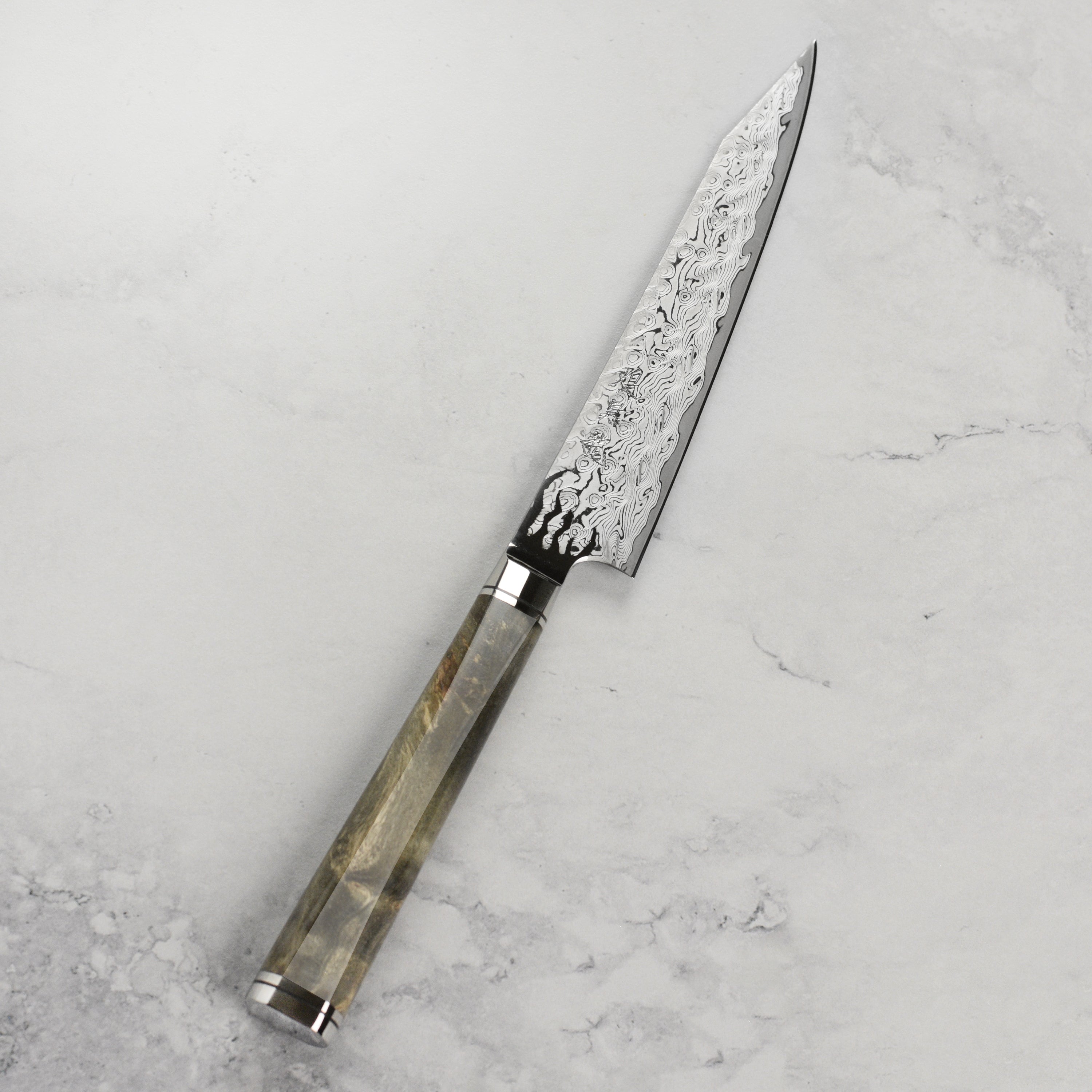 Side view of the handmade Japanese petty knife showing the sharp blade and elegant handle
