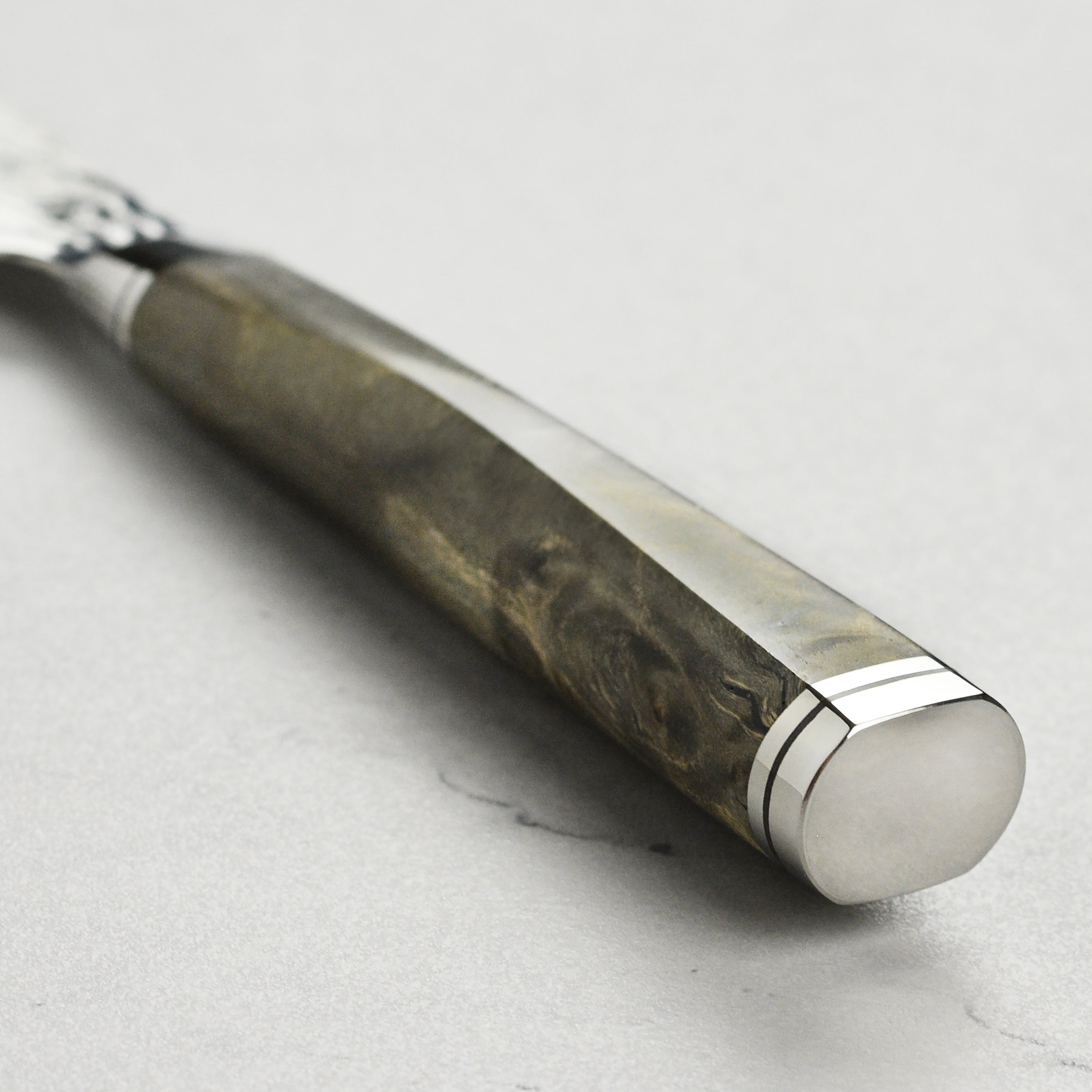 Side view of the handmade Japanese petty knife showing the sharp blade and elegant handle