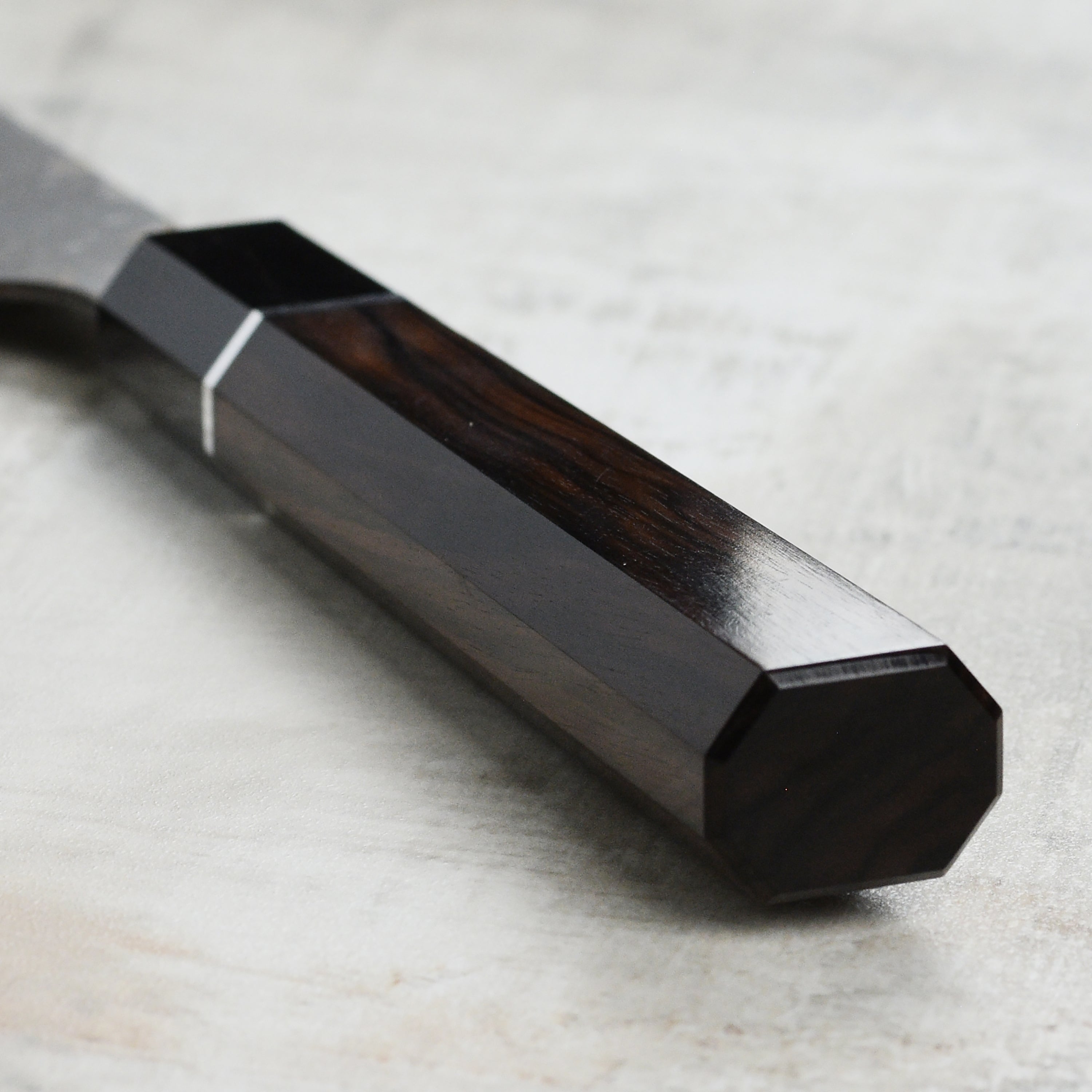 Japanese handcrafted gyuto knife with ebony handle and Damascus steel finish