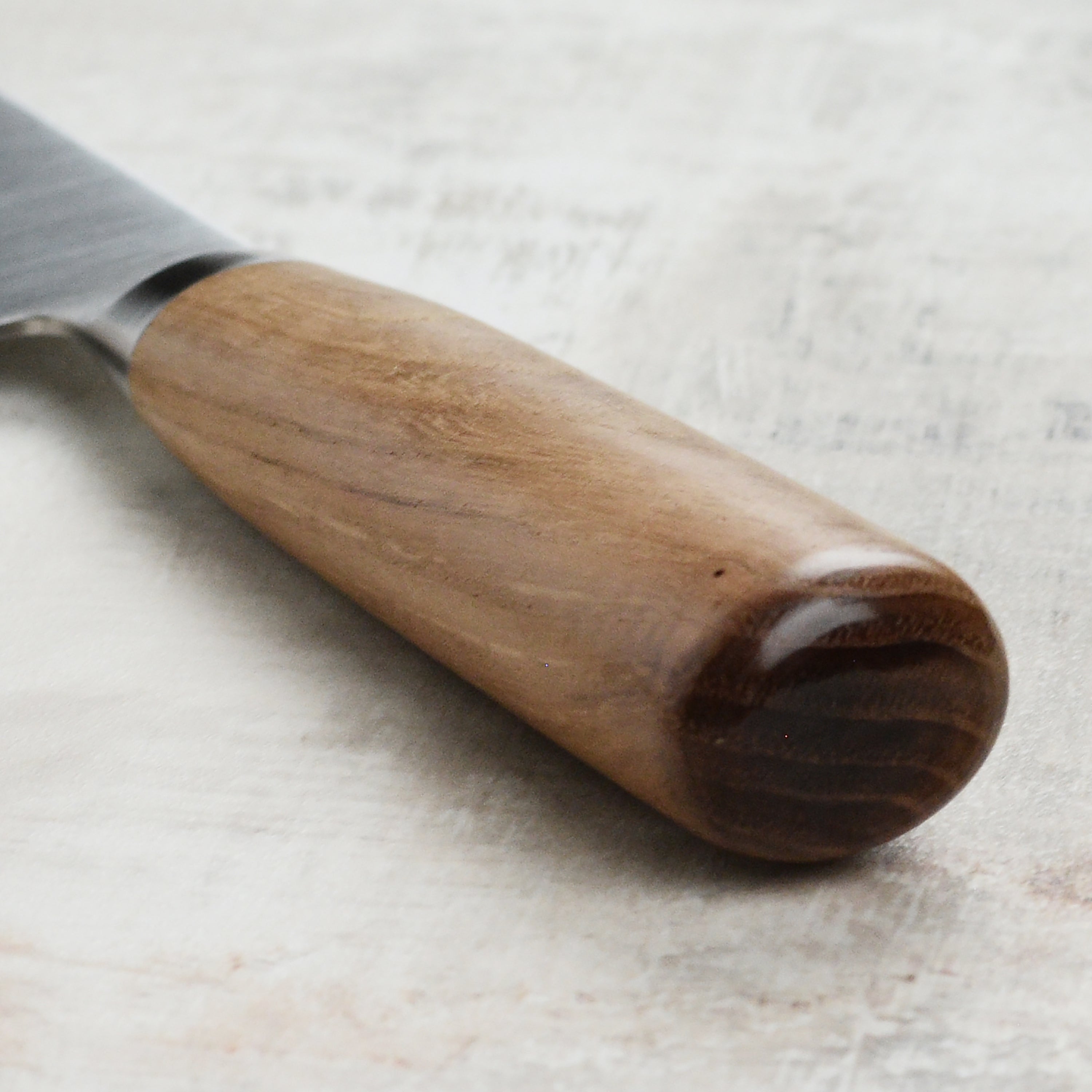Top-rated kitchen knives for chefs, featuring the Tadafusa gyuto on a cutting board