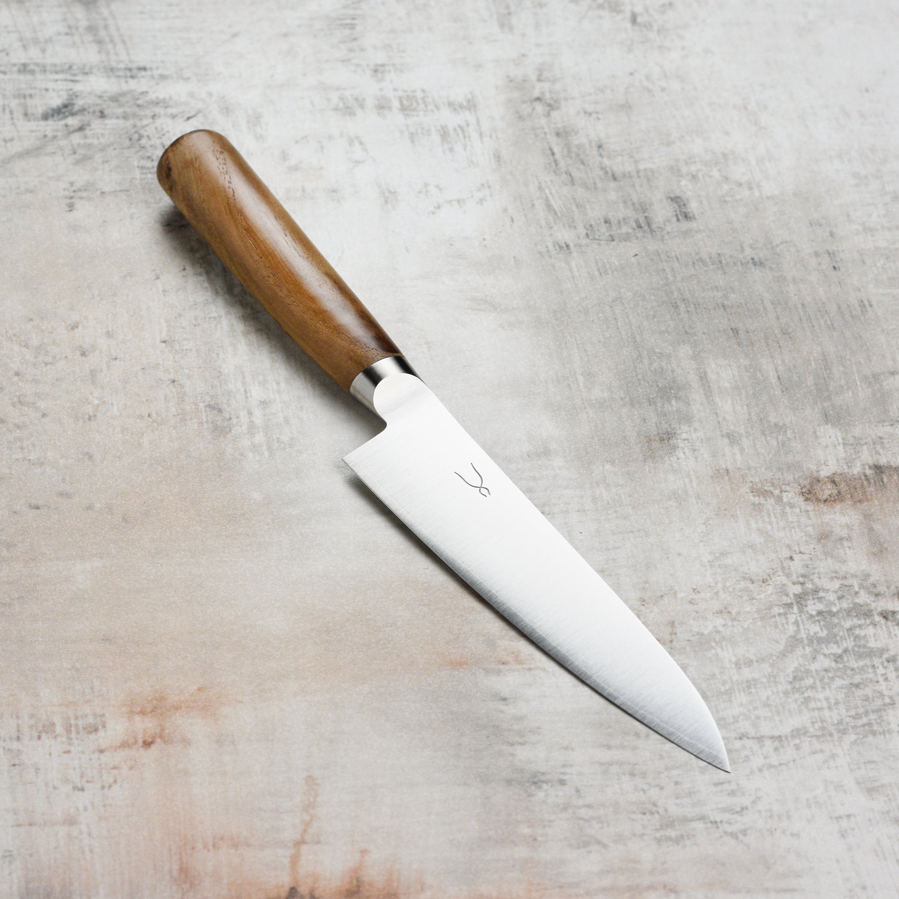 Tadafusa Hocho Kobo petty knife showcasing the sharp blade and ergonomic handle from a top view.