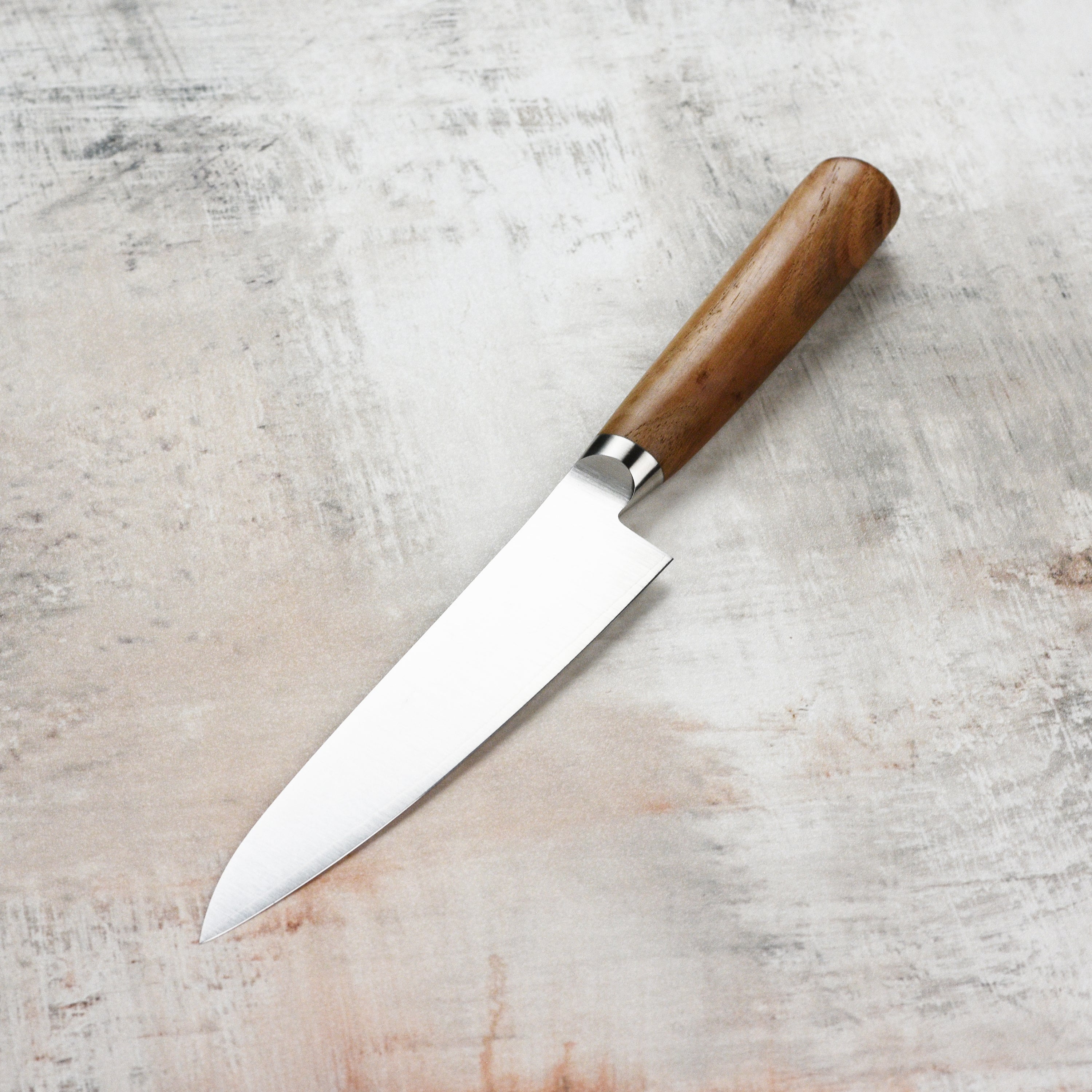 Tadafusa Hocho Kobo petty knife showcasing the sharp blade and ergonomic handle from a top view.