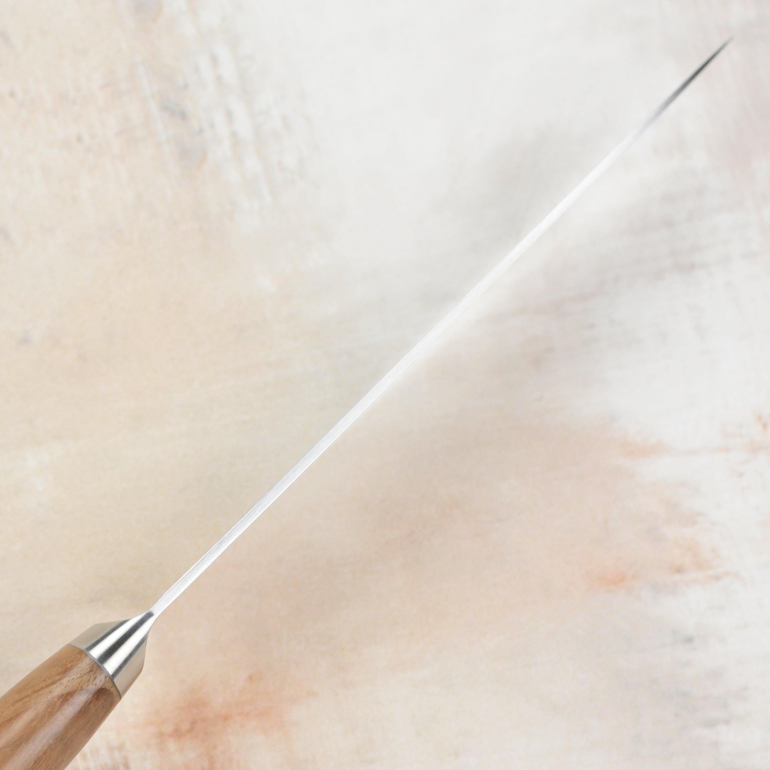 Tadafusa Hocho Kobo petty knife showcasing the sharp blade and ergonomic handle from a top view.
