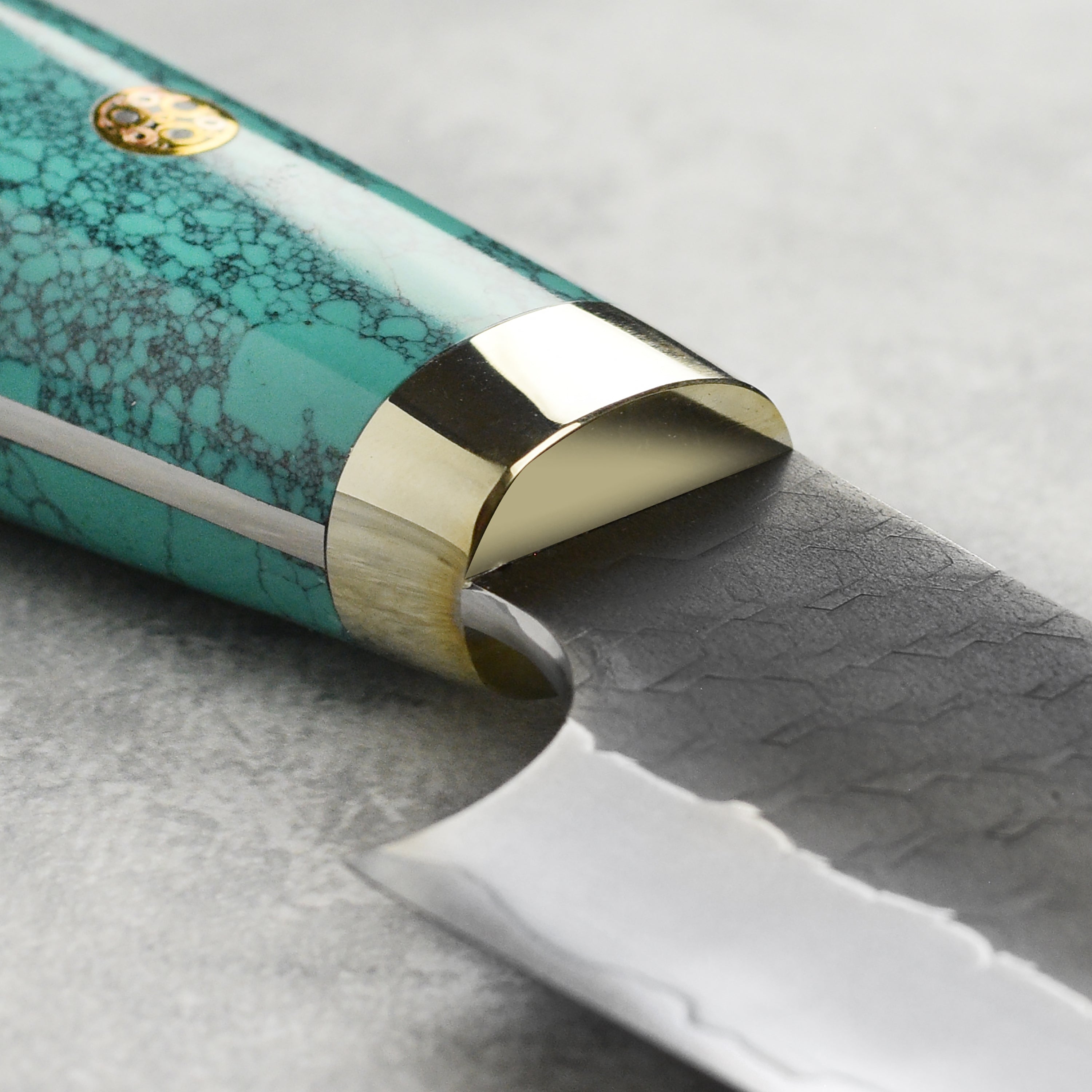Close-up of Nigara SG2 Kurouchi Sujihiki 10.6 inch blade showcasing its sharp edge for slicing meat.