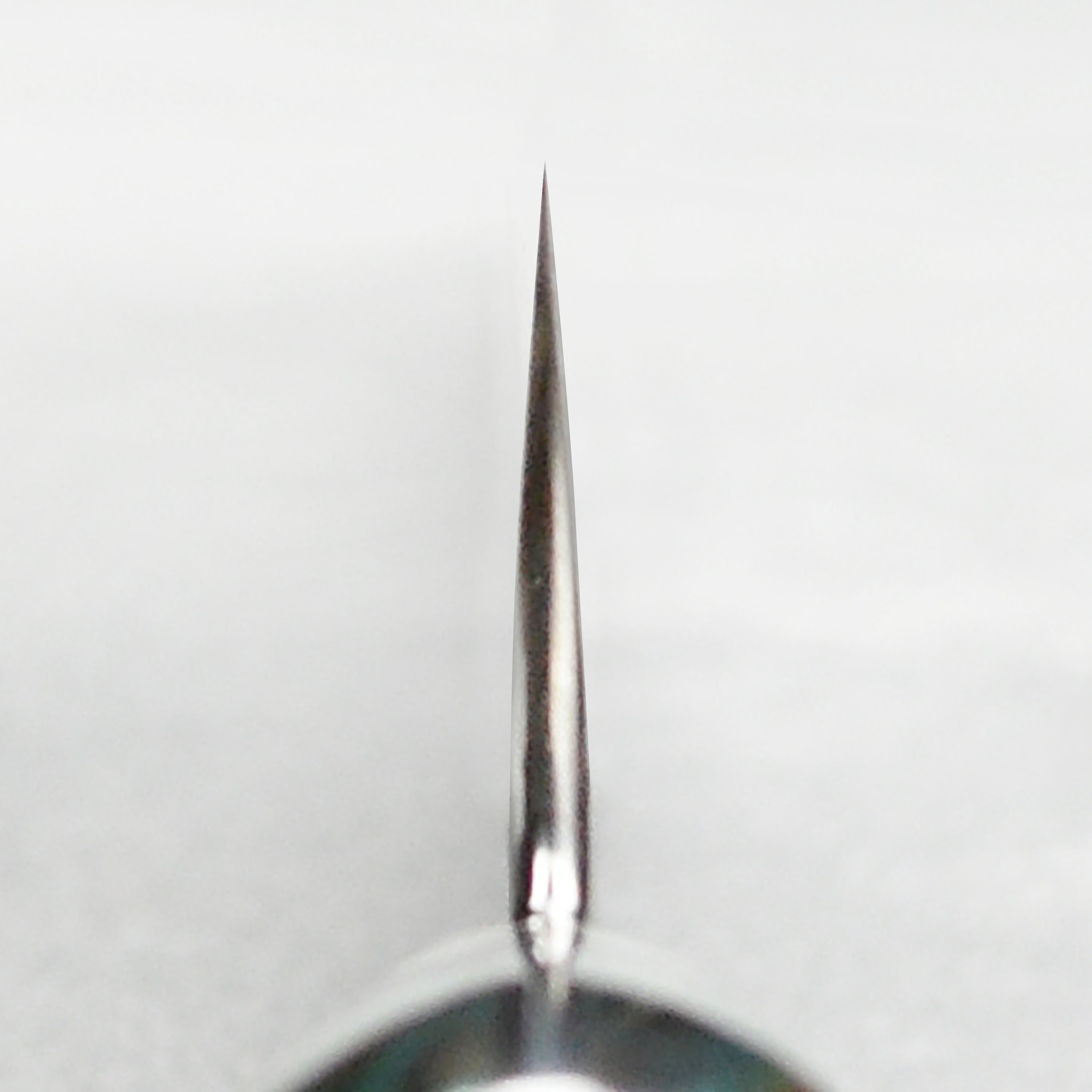 Stylish striped turquoise handle of the kiritsuke knife, emphasizing its craftsmanship and aesthetic appeal