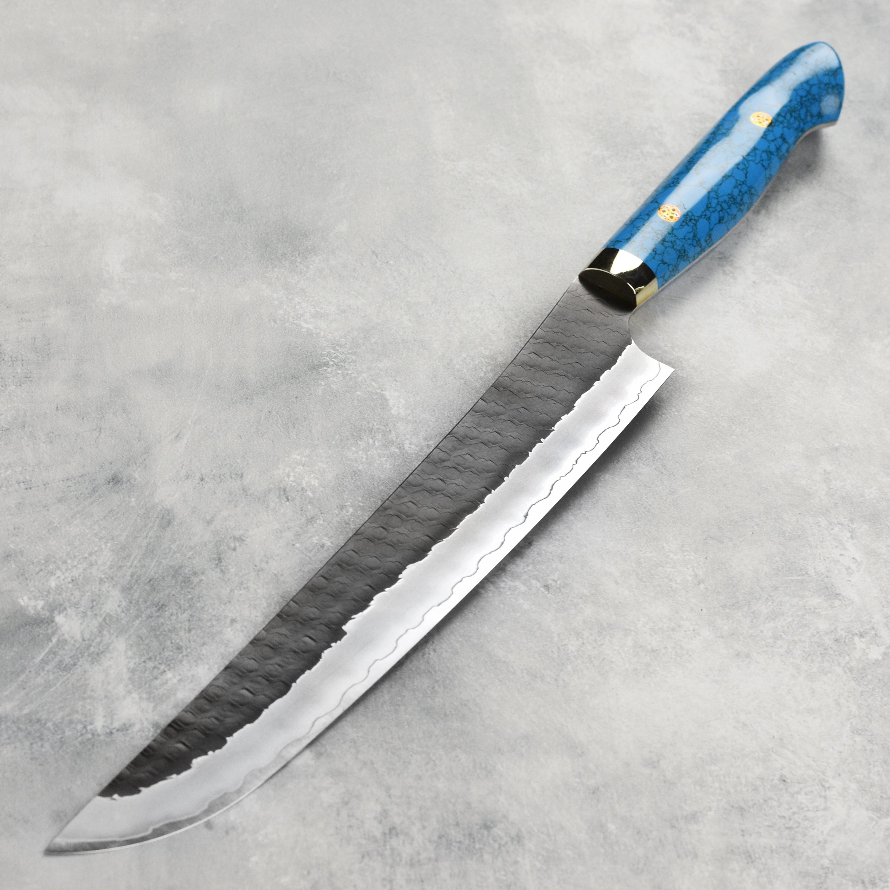 Elegant blue turquoise handle of the Nigara sujihiki chef knife